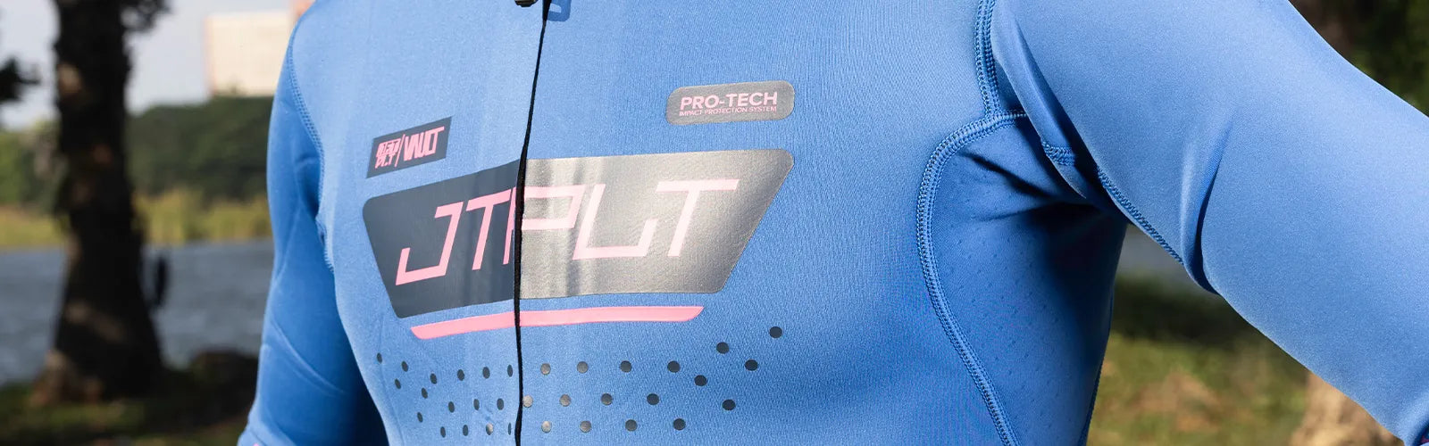 Close-up of a blue Jetpilot mens wetsuit with Pro-Tech impact rib panel on the chest, lakeside