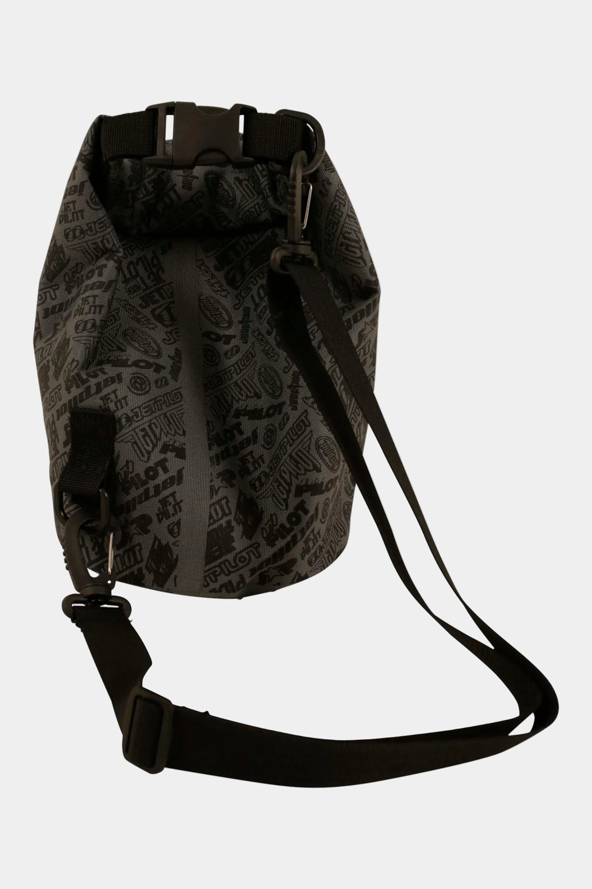 Rear three-quarter view of the Black 40 Year 5L with the logo print, rolled top buckled and shoulder strap attached