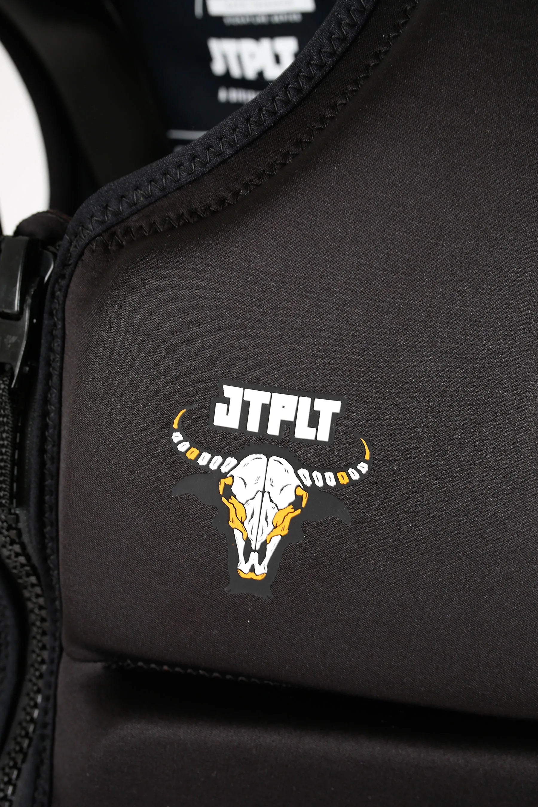 Jetpilot X1 Life Jacket - Raph Trinidad Signature Series - Black with a logo featuring a skull and 'JTPLT' text on a dark background