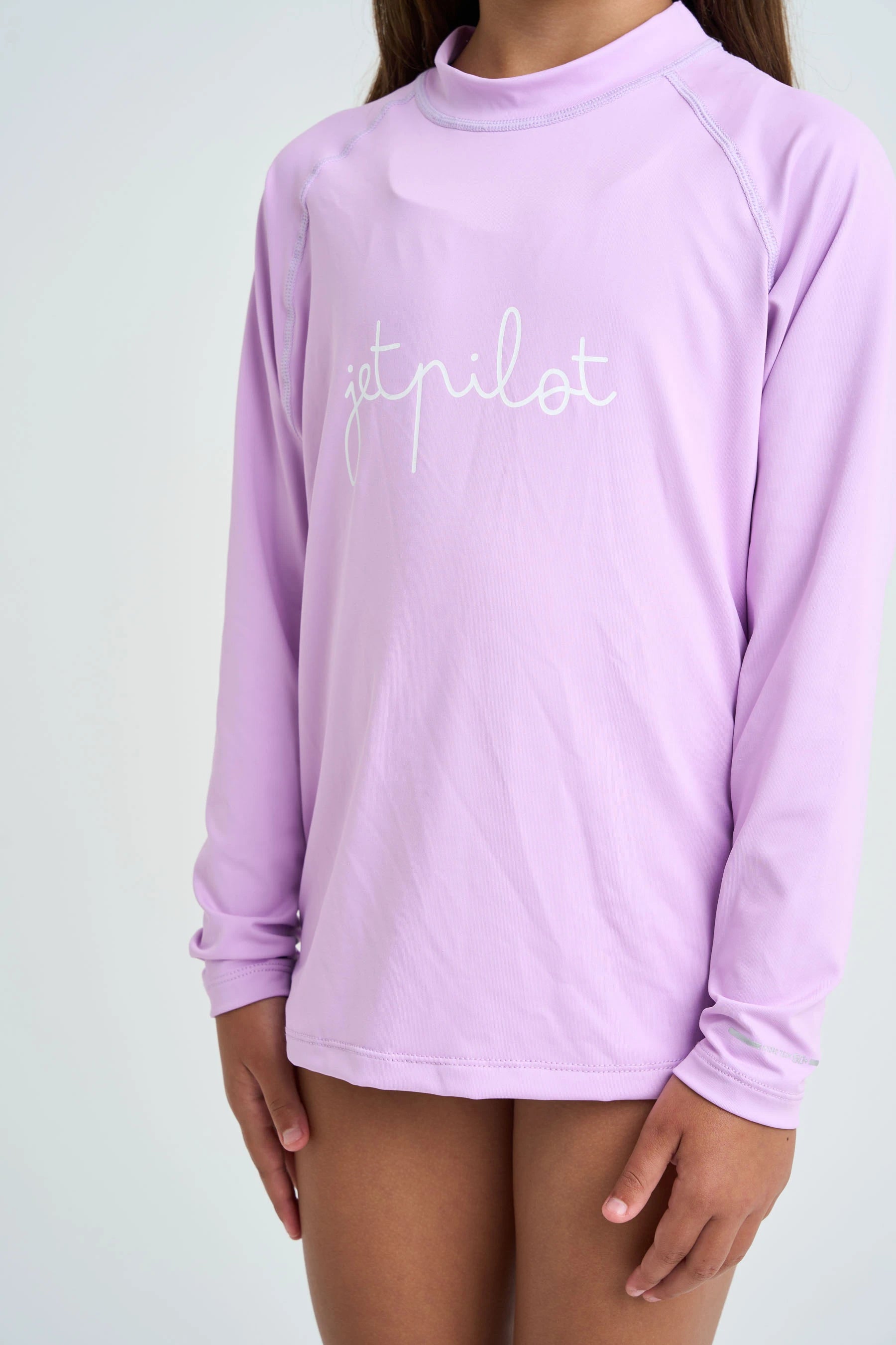 Purple long-sleeve shirt with 'Jetpilot' text on a plain background