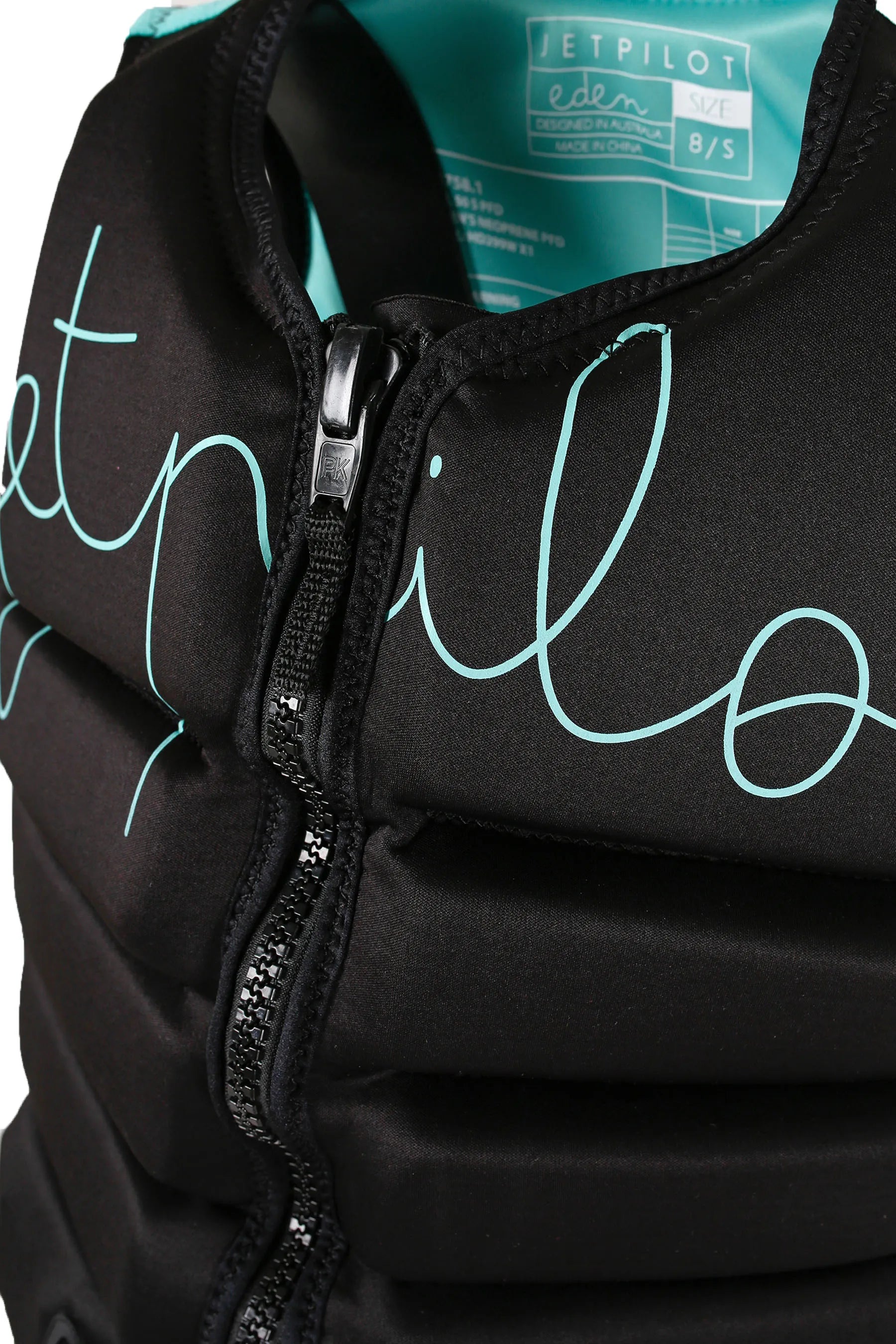 Close-up of a Jetpilot Eden Ladies PWC Life Jacket - Black with 'Jetpilot' branding on a grey background