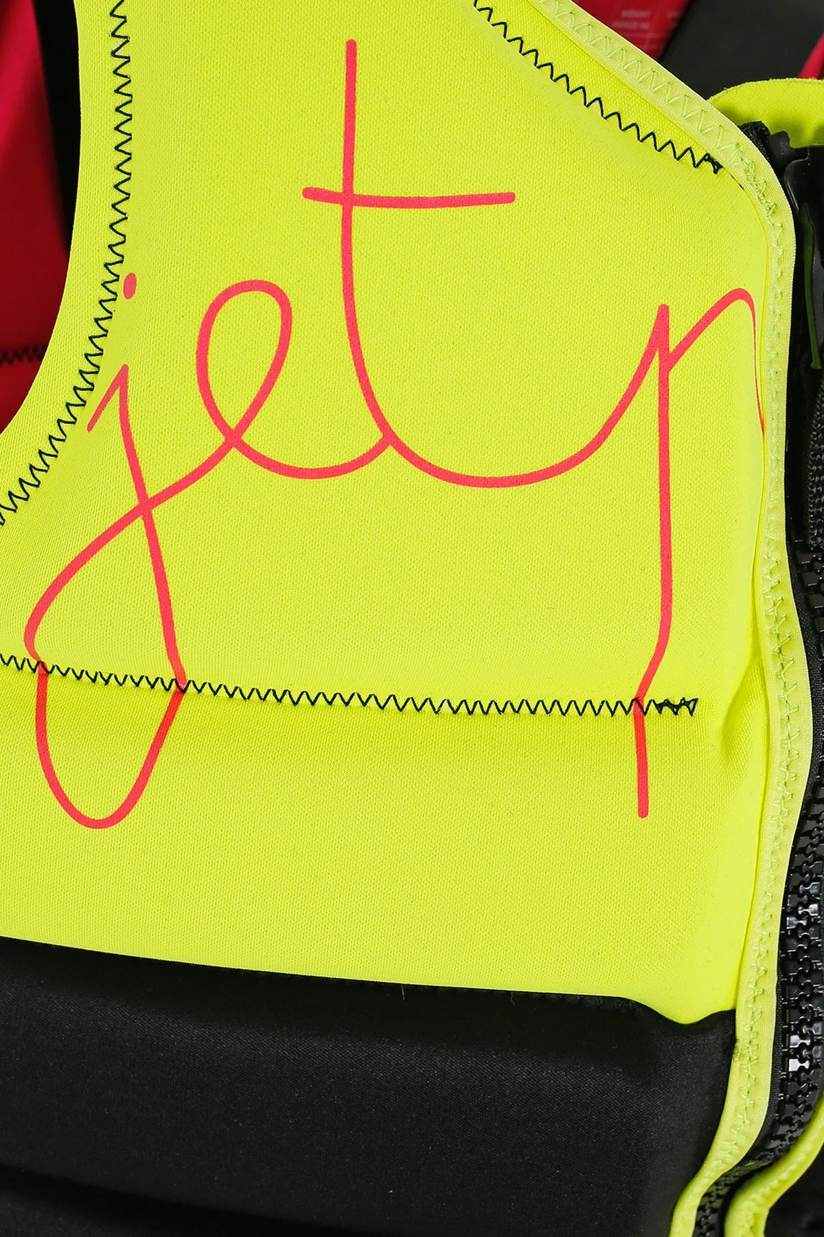 Neon yellow ladies life jacket chest with pink 'jetpilot' logo on a black background