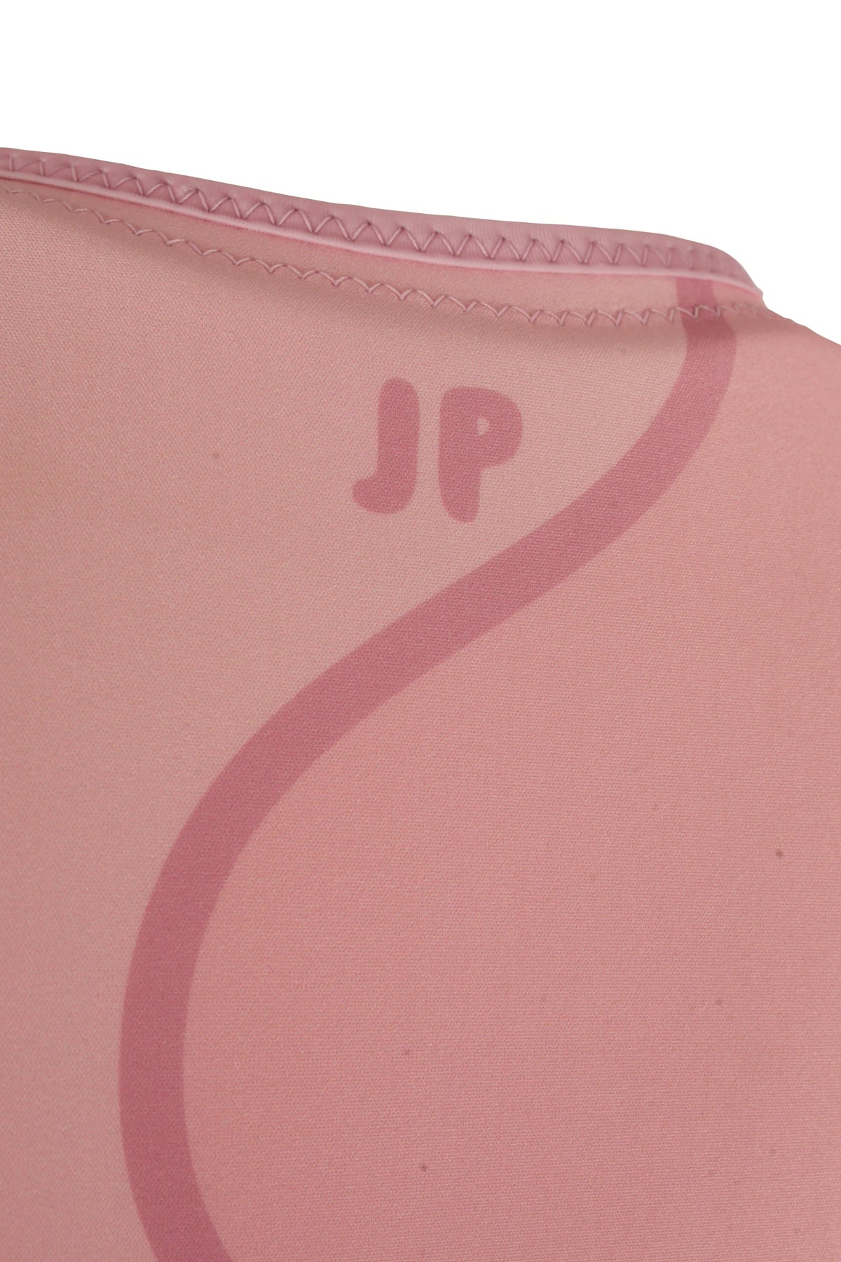 Close-up of the small JP logo and the wavy line on the upper back of the Pink Allure