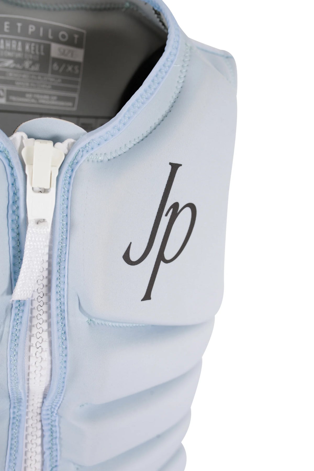 Close-up of the black Jp monogram on the chest and the zip at the collar of the Ice Blue Zahra X1