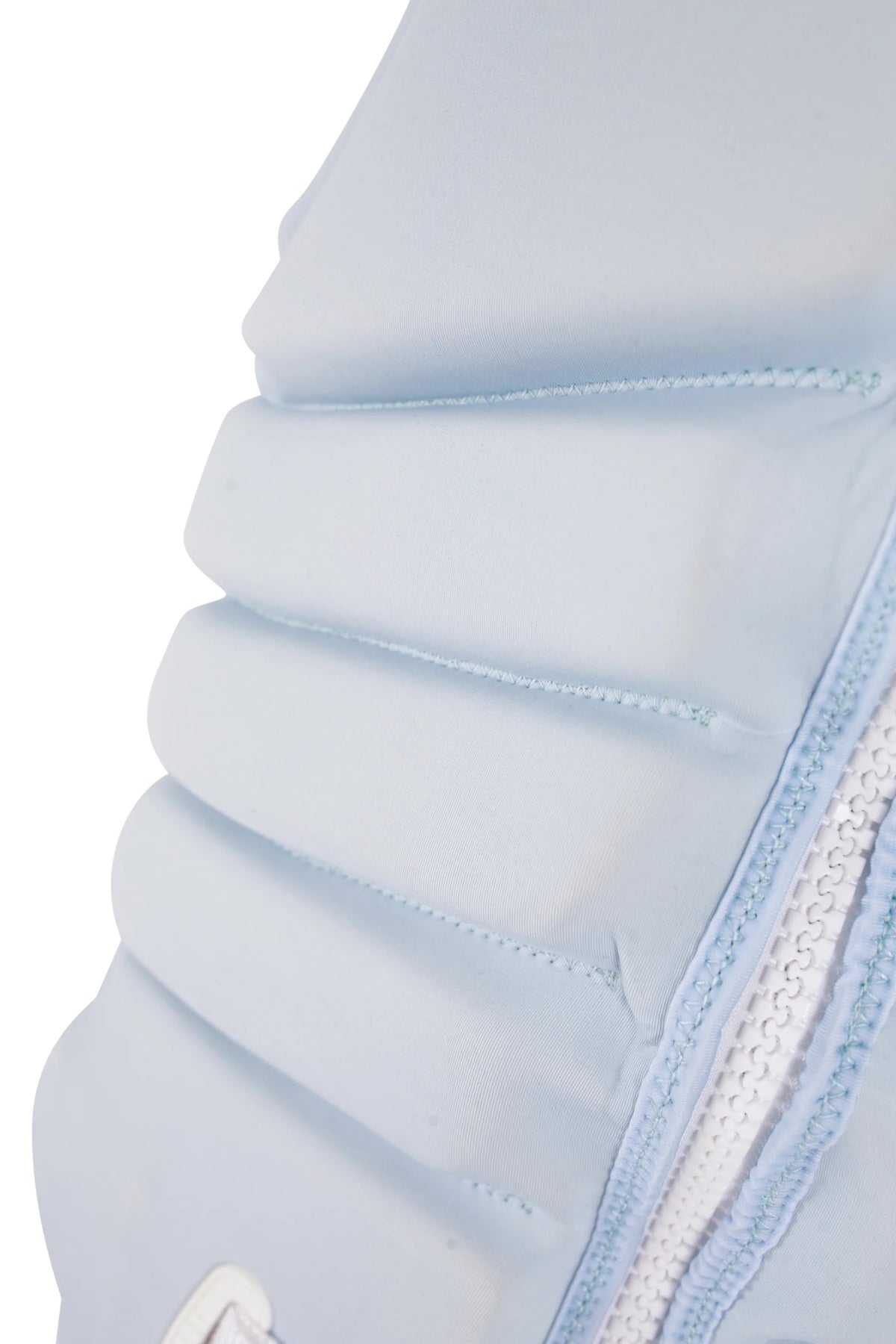 Close-up of the segmented front foam panels beside the zip on the Ice Blue Zahra X1