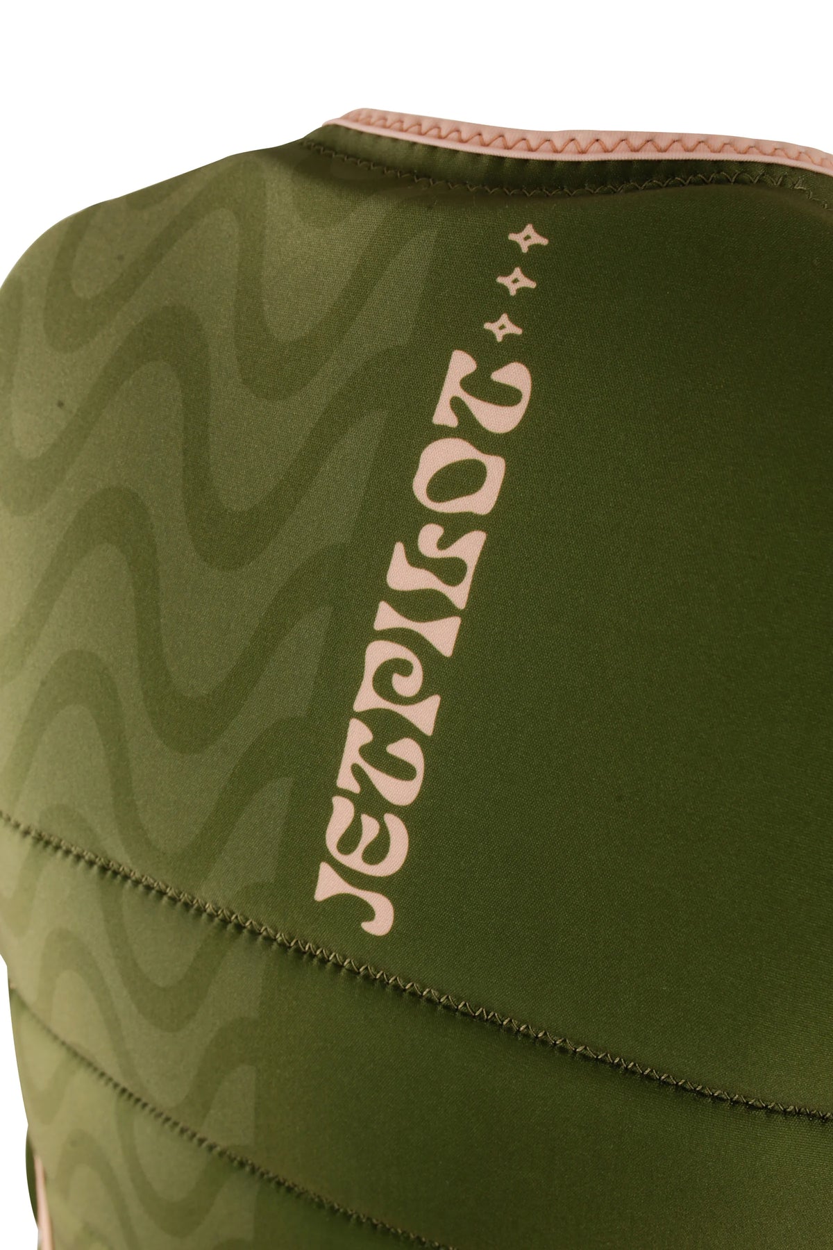 Close-up of the vertical Jetpilot logo and sparkles beside the wave print on the back of the Olive Luna