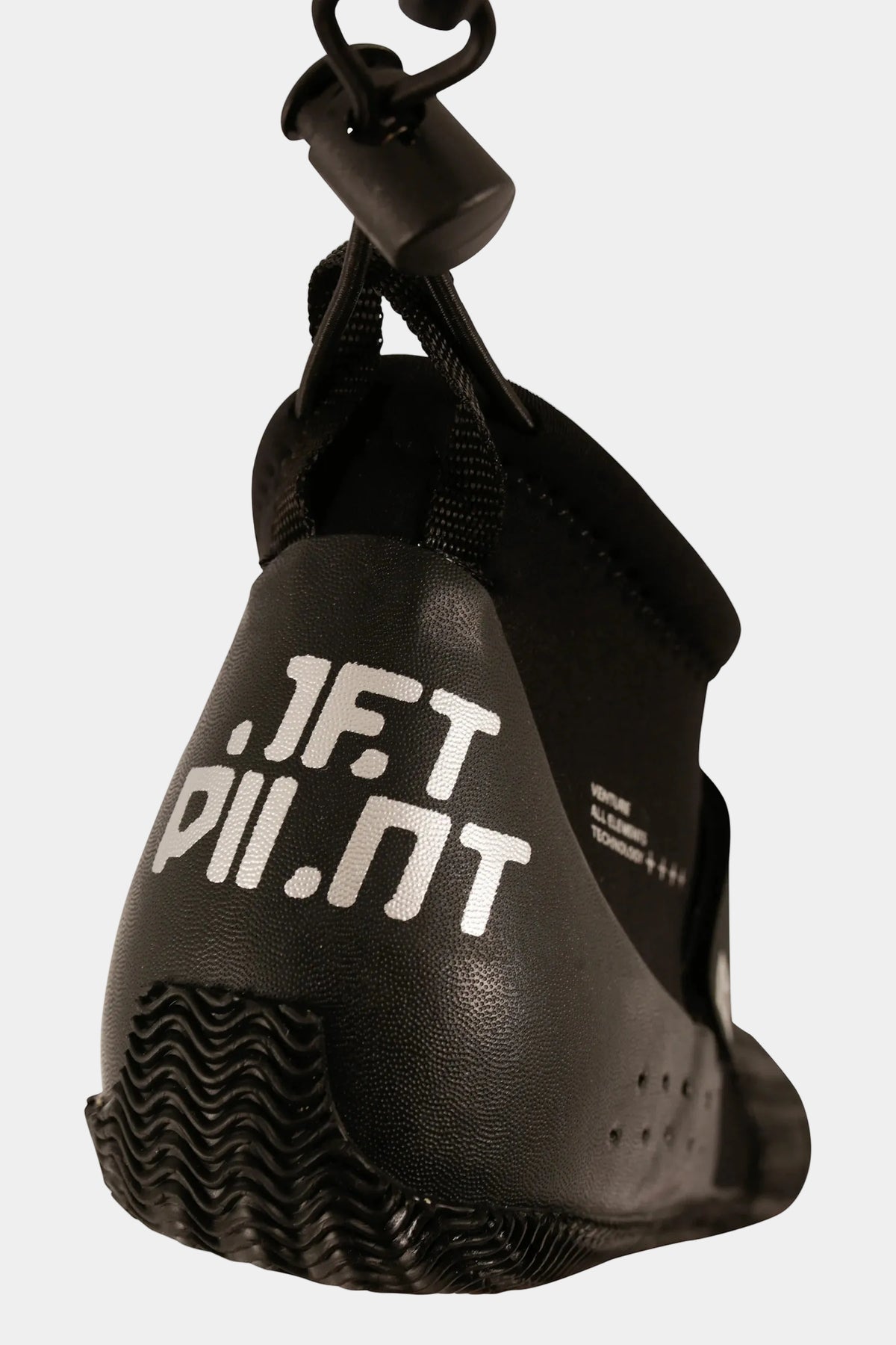 Black Technical Hi-Cut shoe hanging by its drawstring and barrel lock, showing the heel print and tread