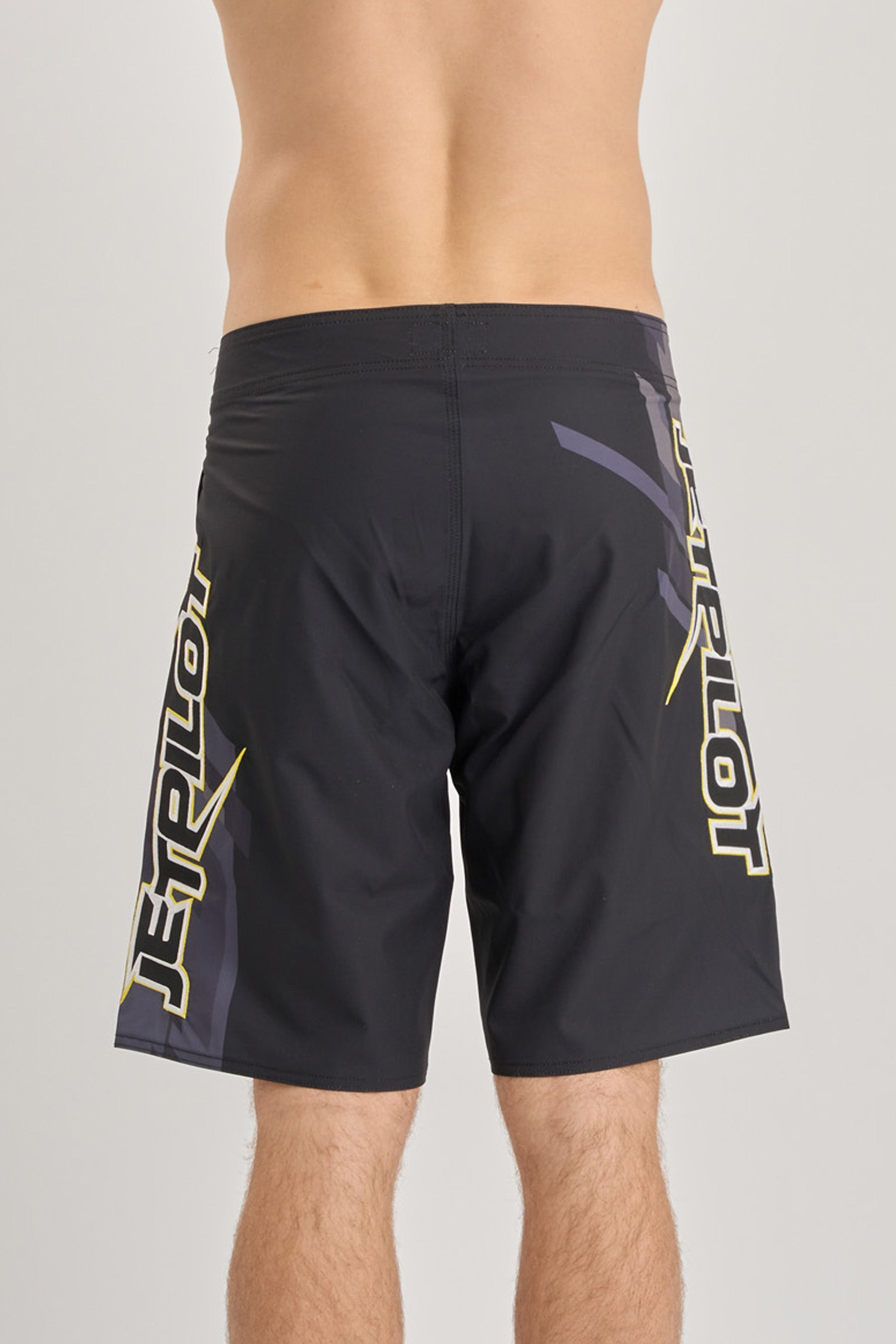 Black shorts with branding on a gray background