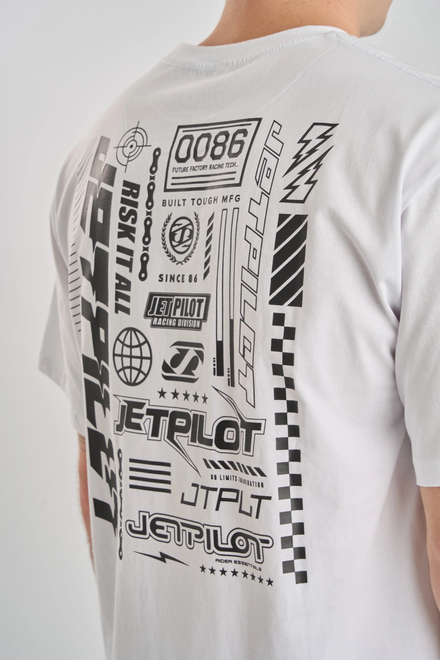 White t-shirt with black logo graphic designs and text on a plain background — image 2