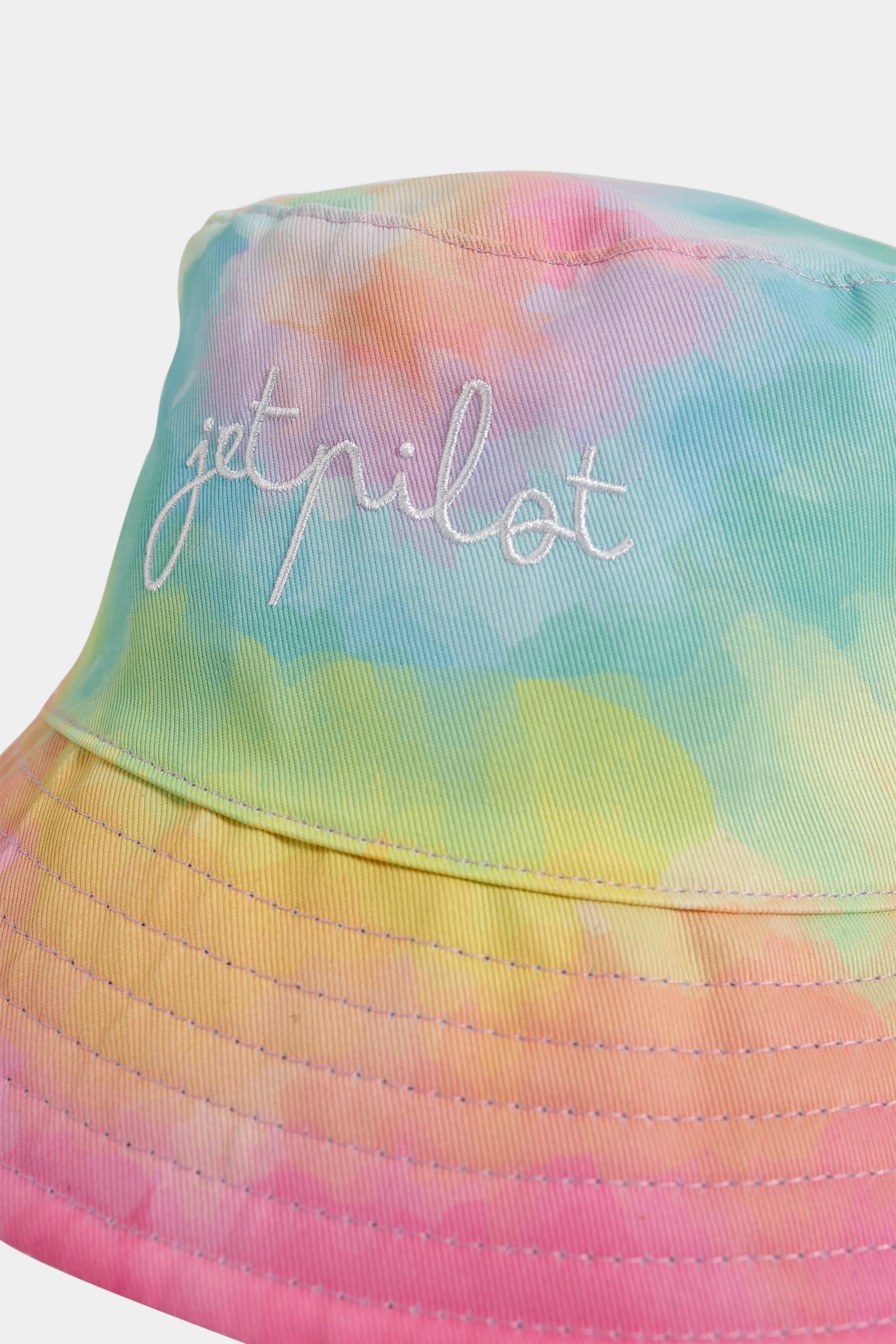 Tie-dye bucket hat with 'Jetpilot' text on a white background