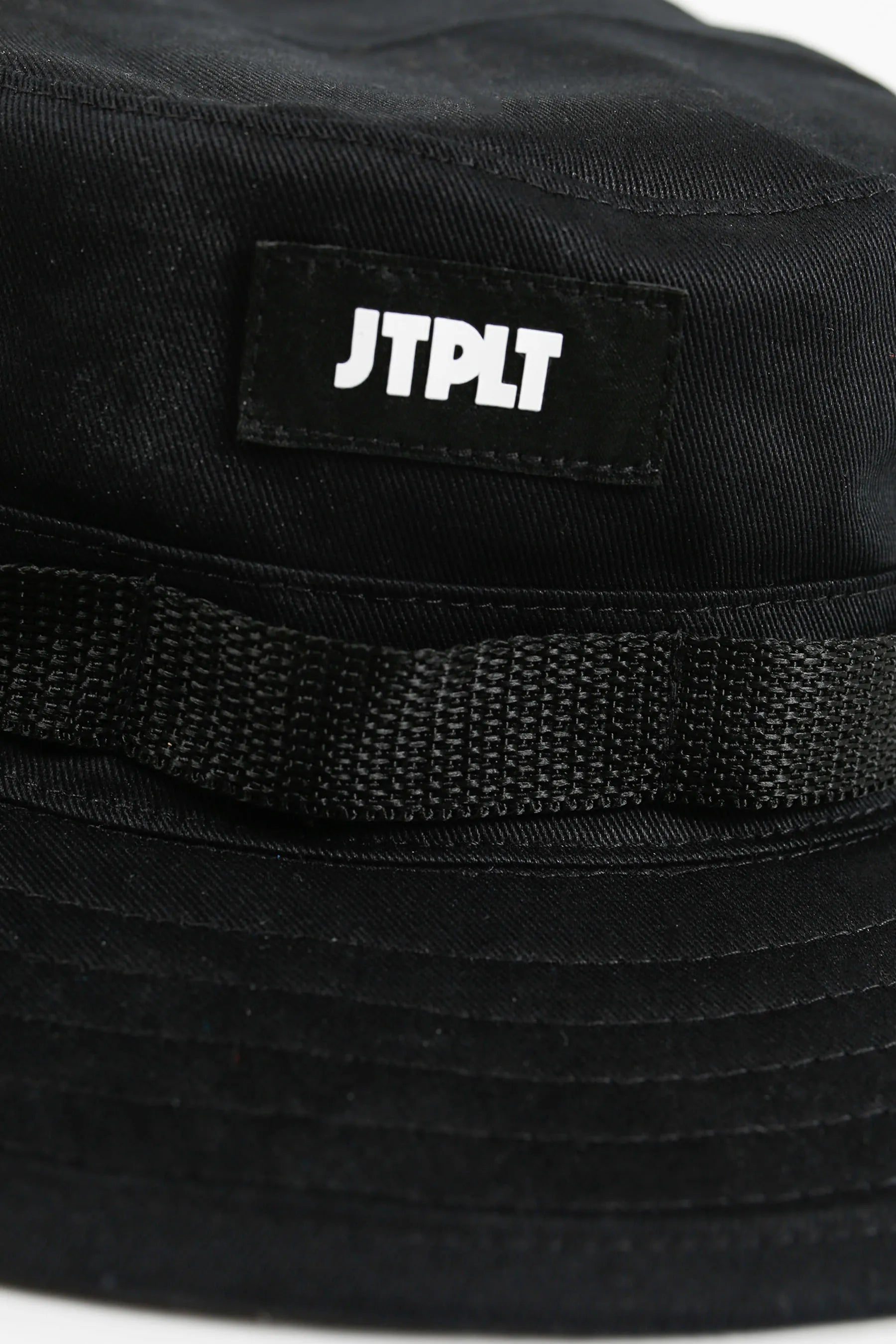 Black bucket hat with JTPLT logo on a white background