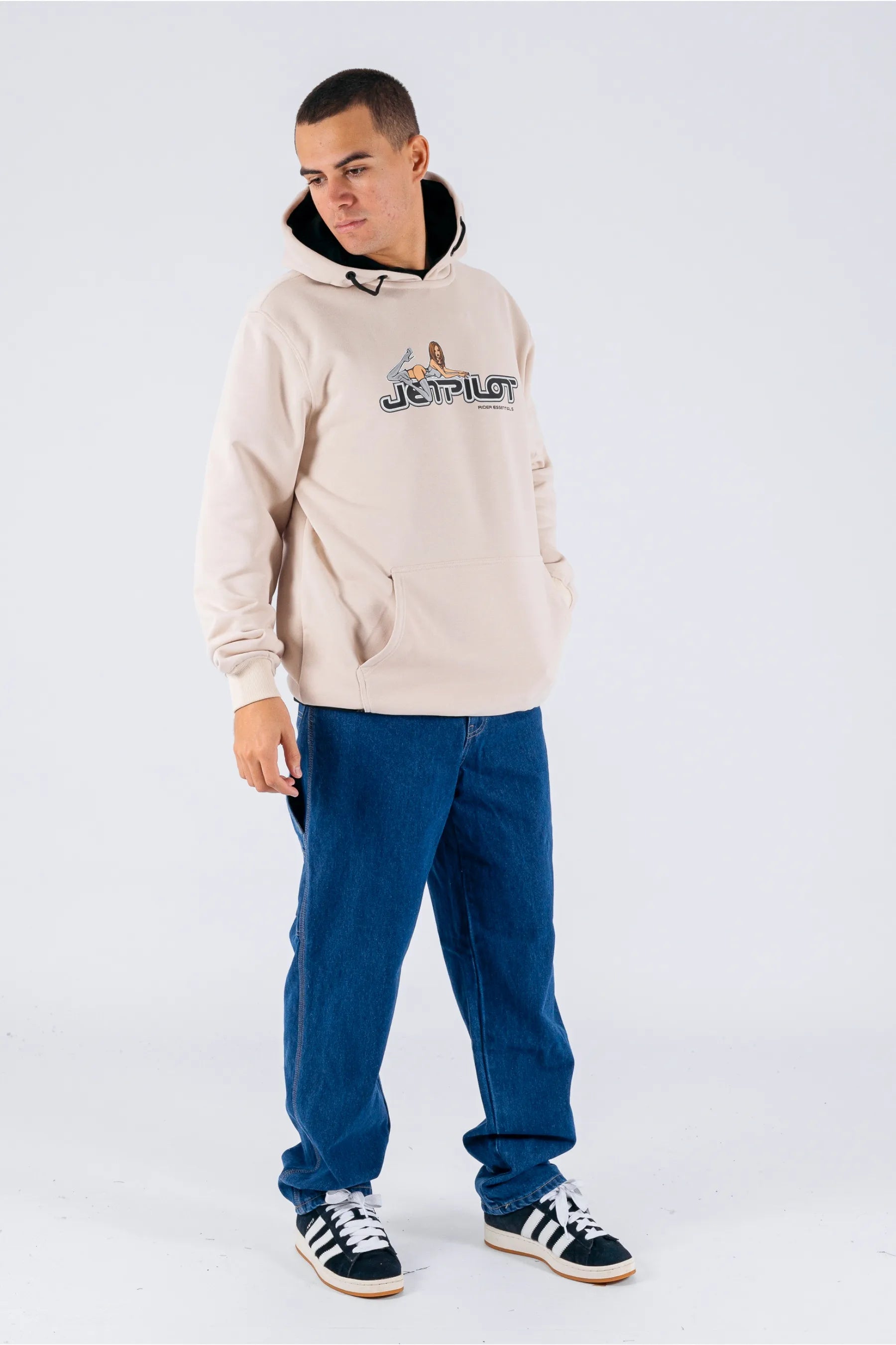 a person wearing a cement pullover with a Jetpilot logo, blue shorts and a black/white shoes — view 4 (3)
