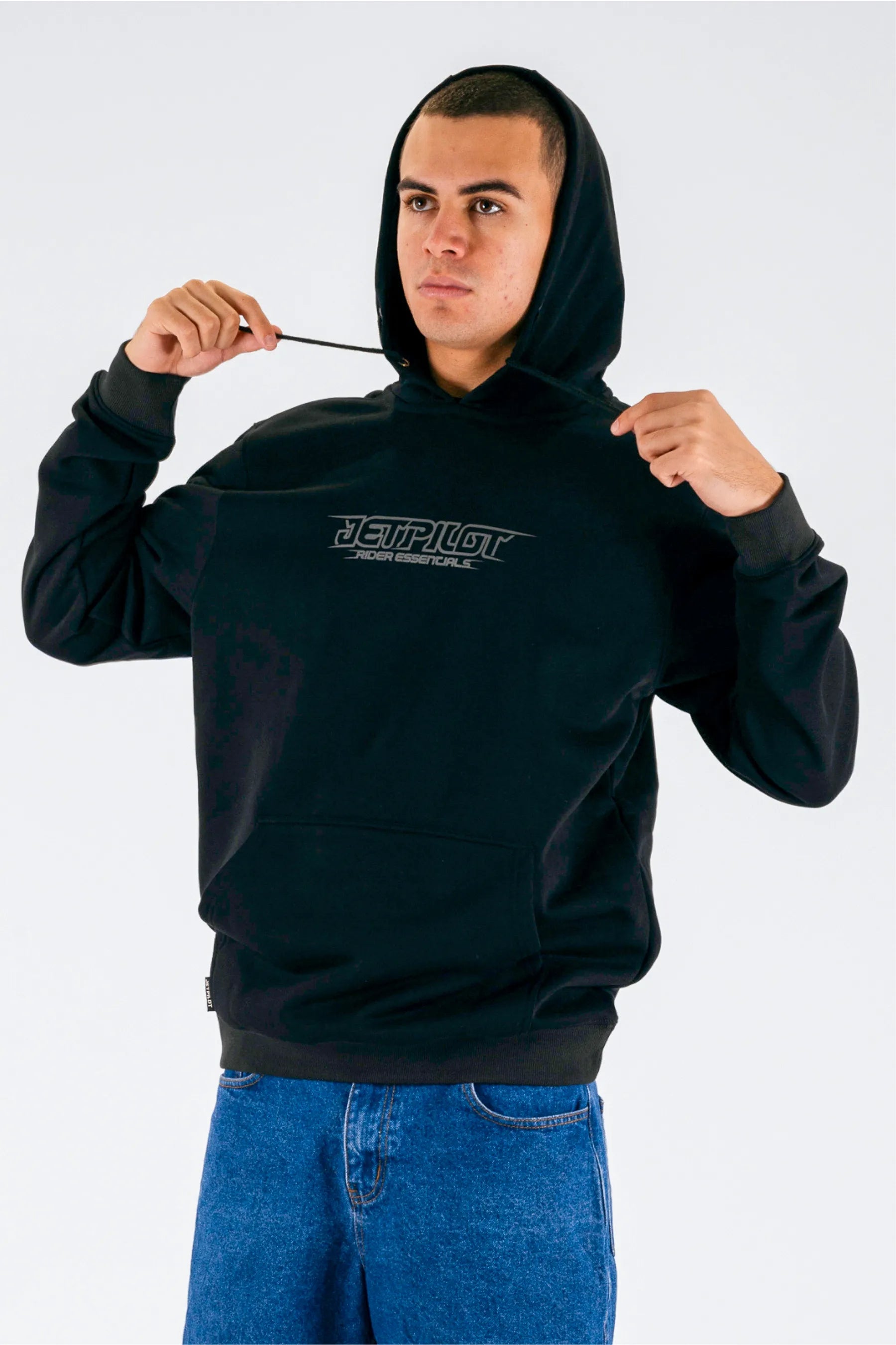 a person wearing a black pullover with a Jetpilot logo on a white background — view 3 (3)