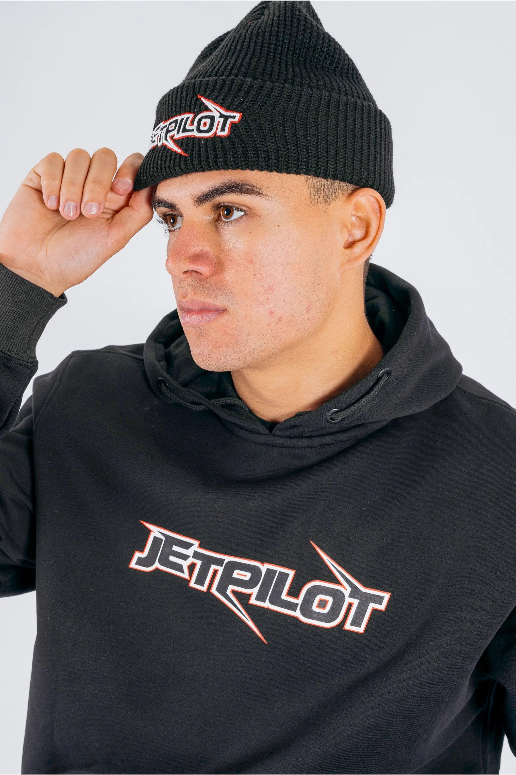 Side view of a person wearing a black beanie with Jetpilot logo on a white background — view 4 (3)