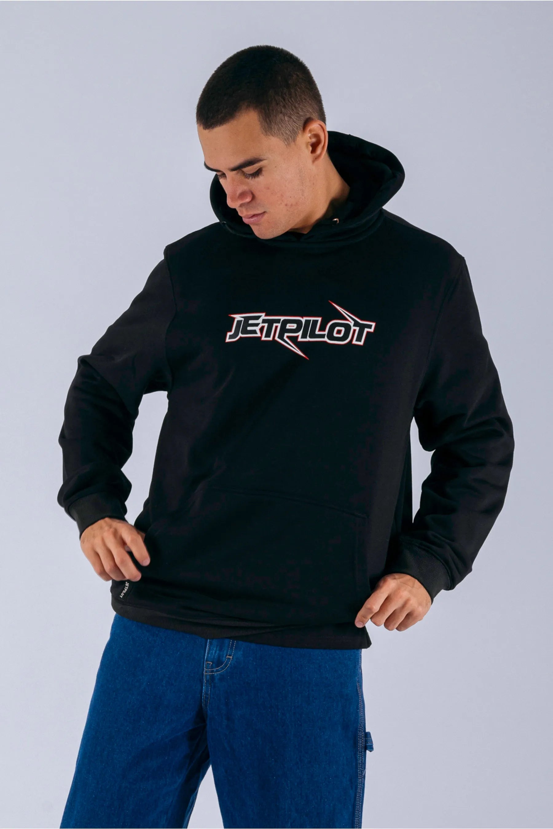 a person wearing a black pullover with a Jetpilot logo — view 4 (6)