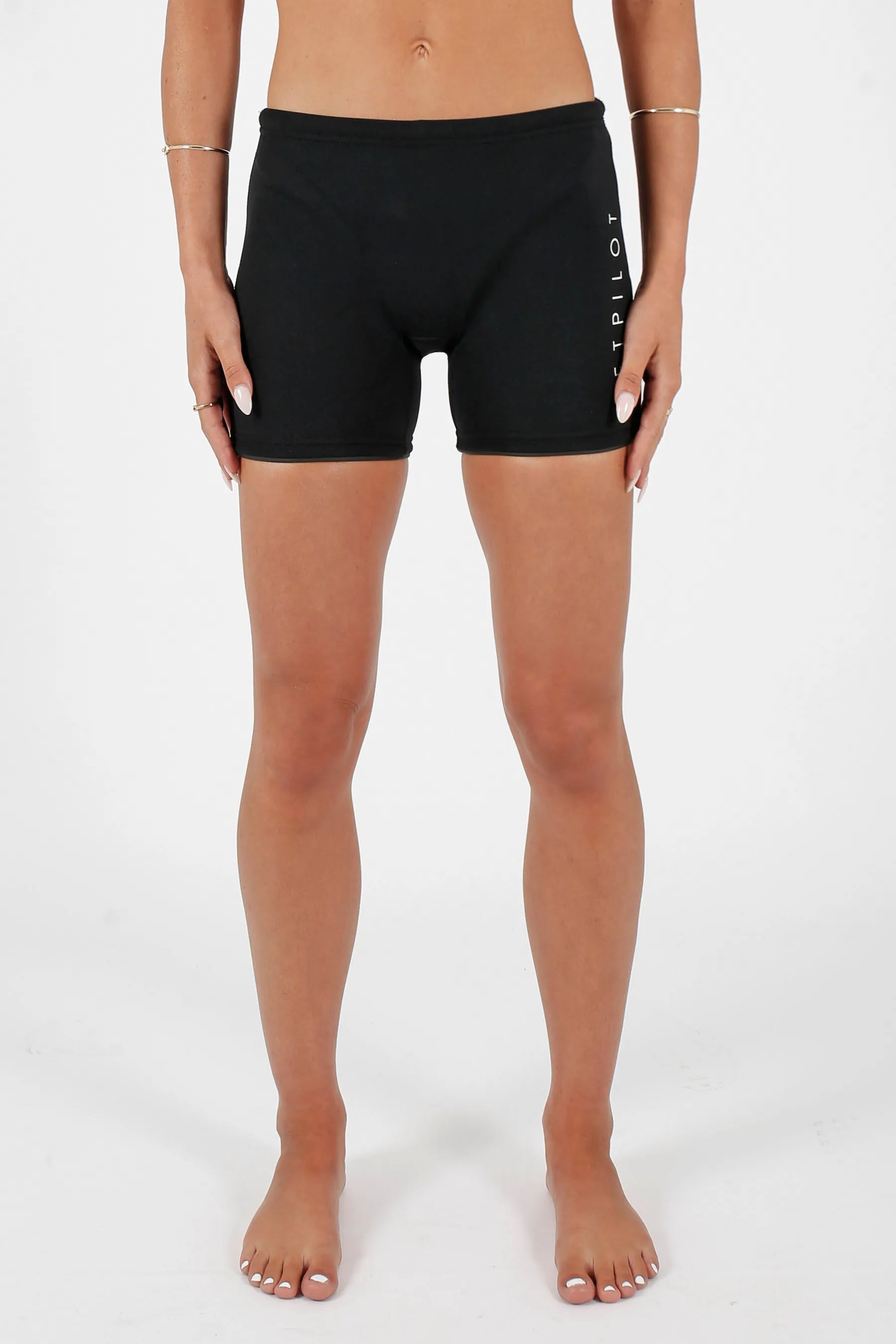 Woman in Jetpilot Corp 5" Neoprene Short - Black with a brand logo on a white background — view 3 (3)
