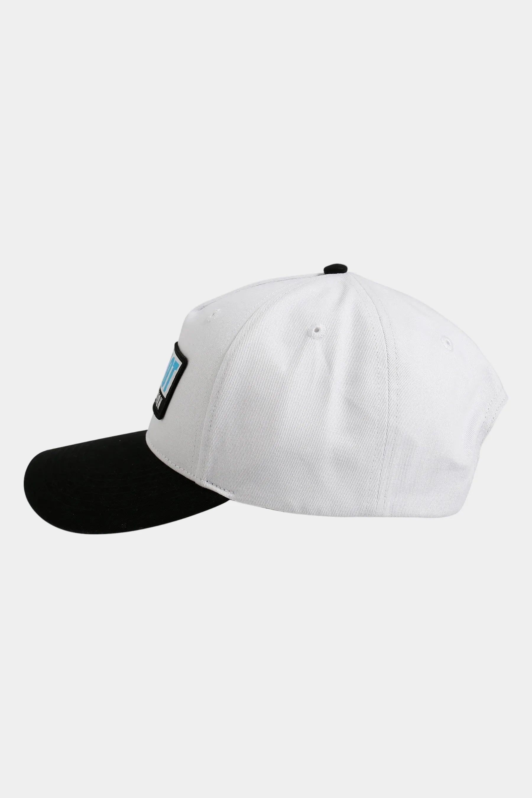 White and black cap on a light grey background