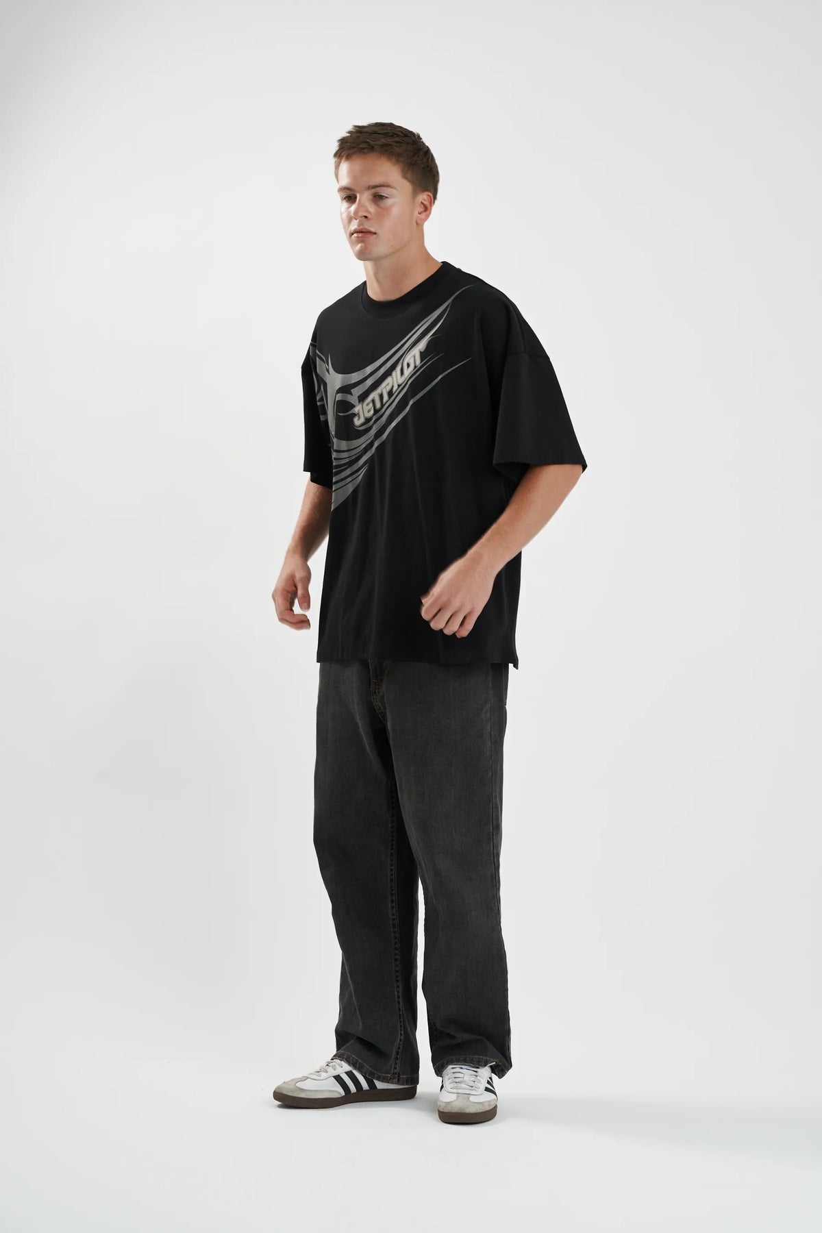 Angled view of the black Jetpilot Sinister Tee and its wrap print