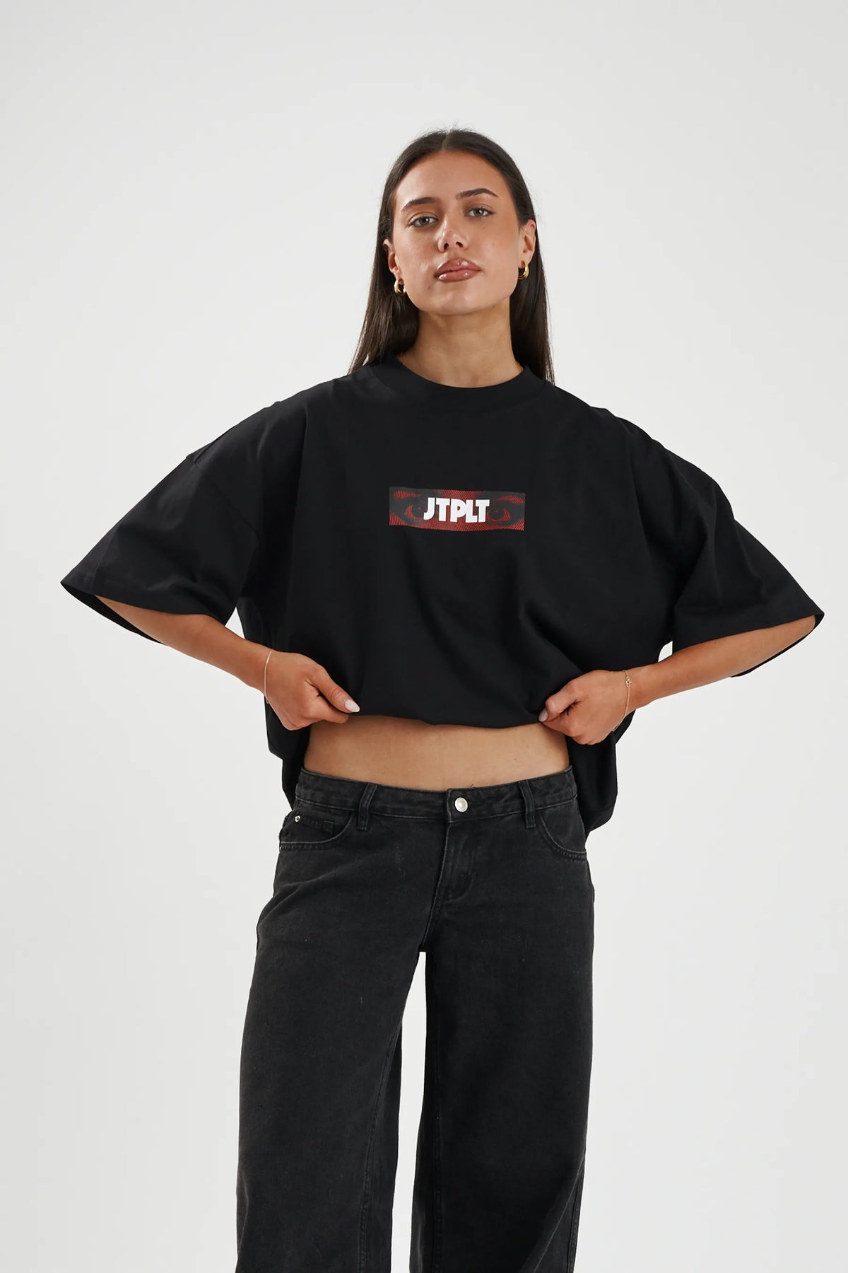 Jetpilot Spiral mens oversized graphic tee in Black — front view on a female model