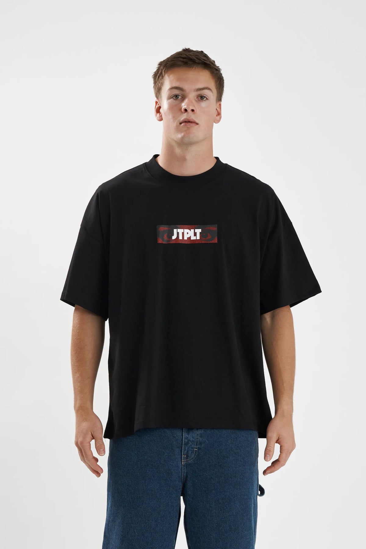 Jetpilot Spiral mens oversized graphic tee in Black — front view on a male model