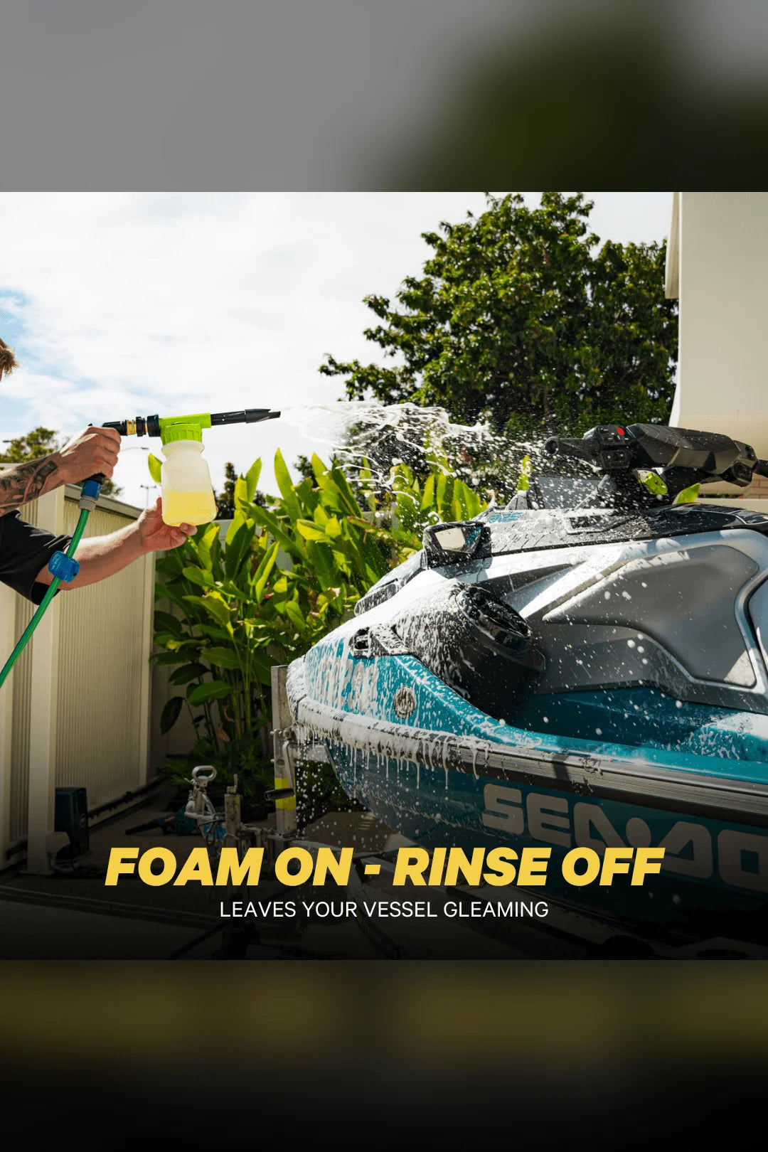 Rider foaming a Sea-Doo jet ski with Salty Hero Salt Wash through a foam gun, foam on and rinse off