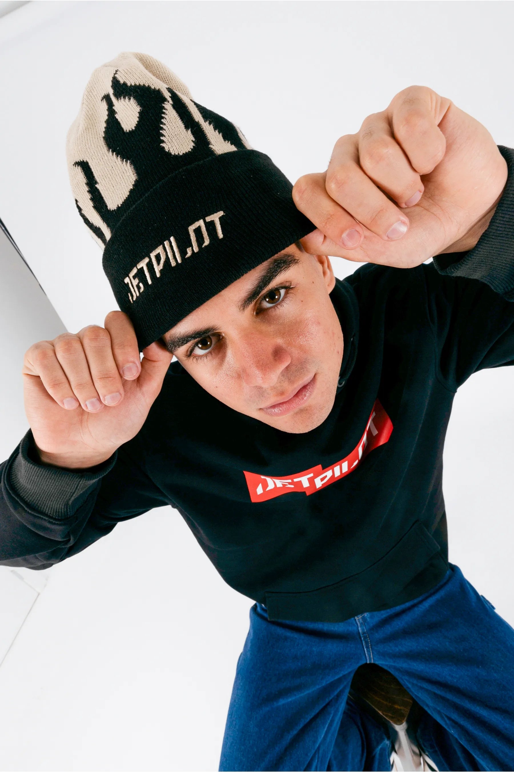 High view of a person wearing a cement beanie with Jetpilot logo on a white background — view 1 (3)