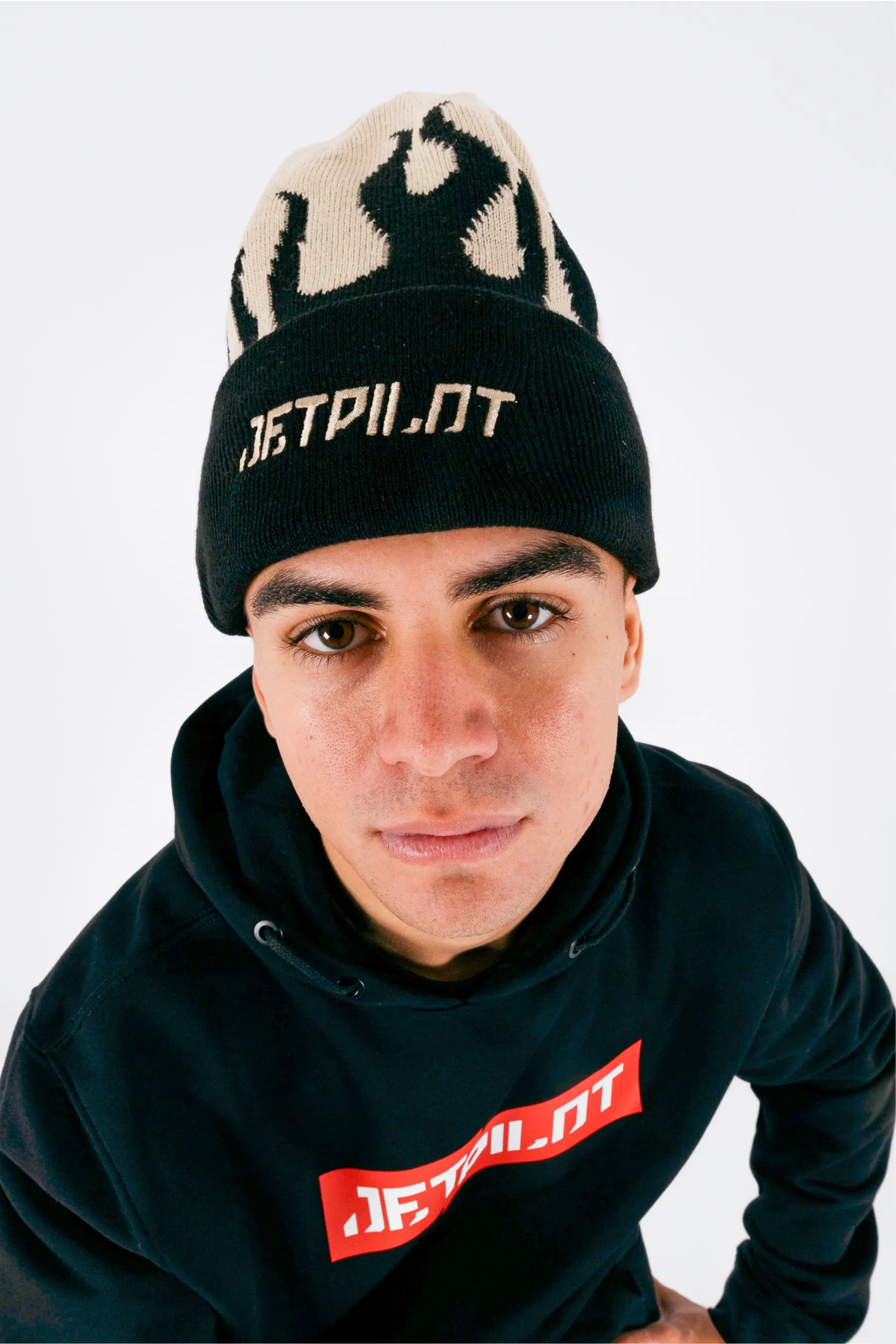 Front view of a person wearing a cement beanie with Jetpilot logo on a white background — view 3 (3)