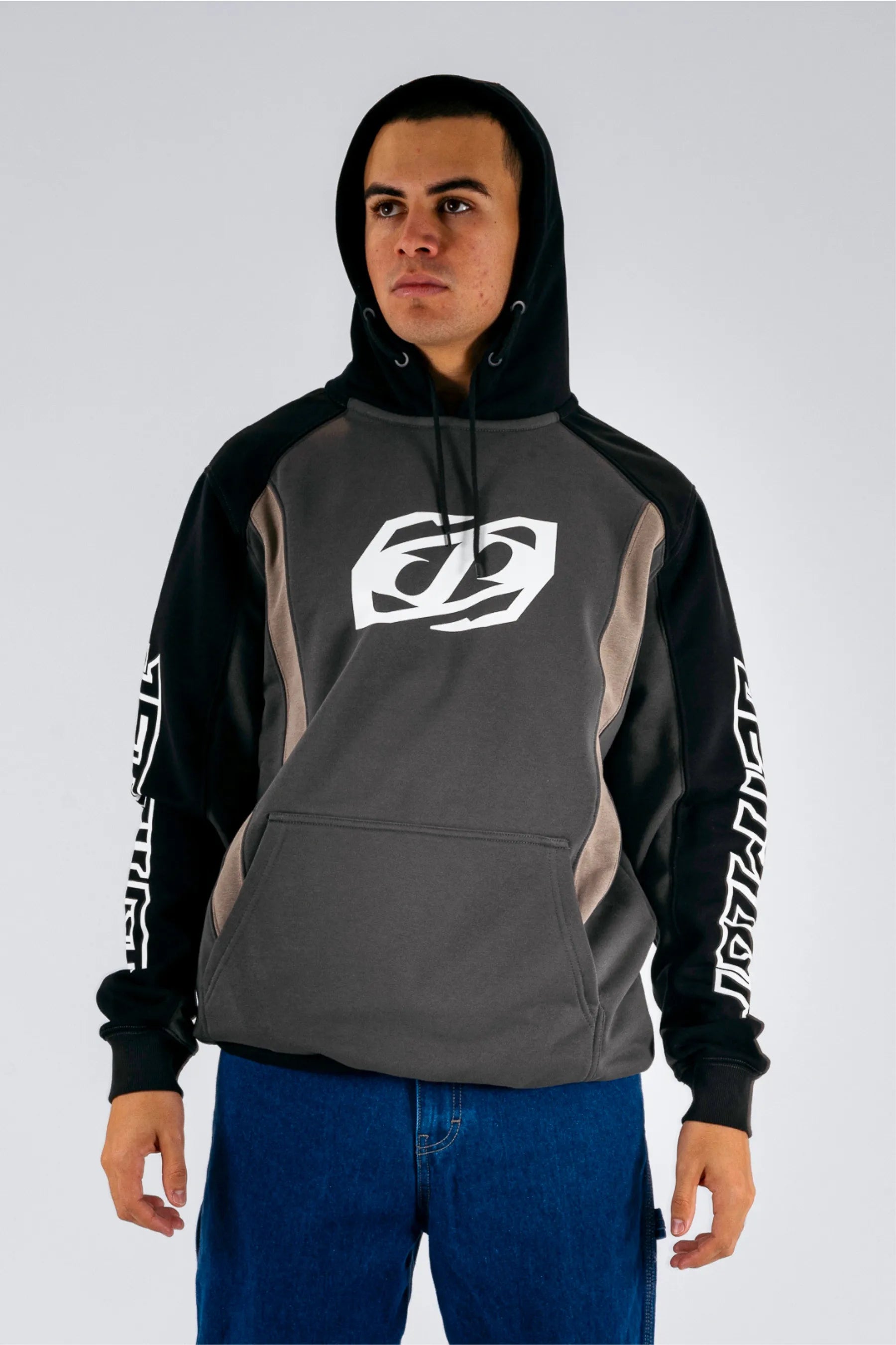 front view of a person wearing a black pullover with a white Jetpilot logo on a white background — view 1 (3)