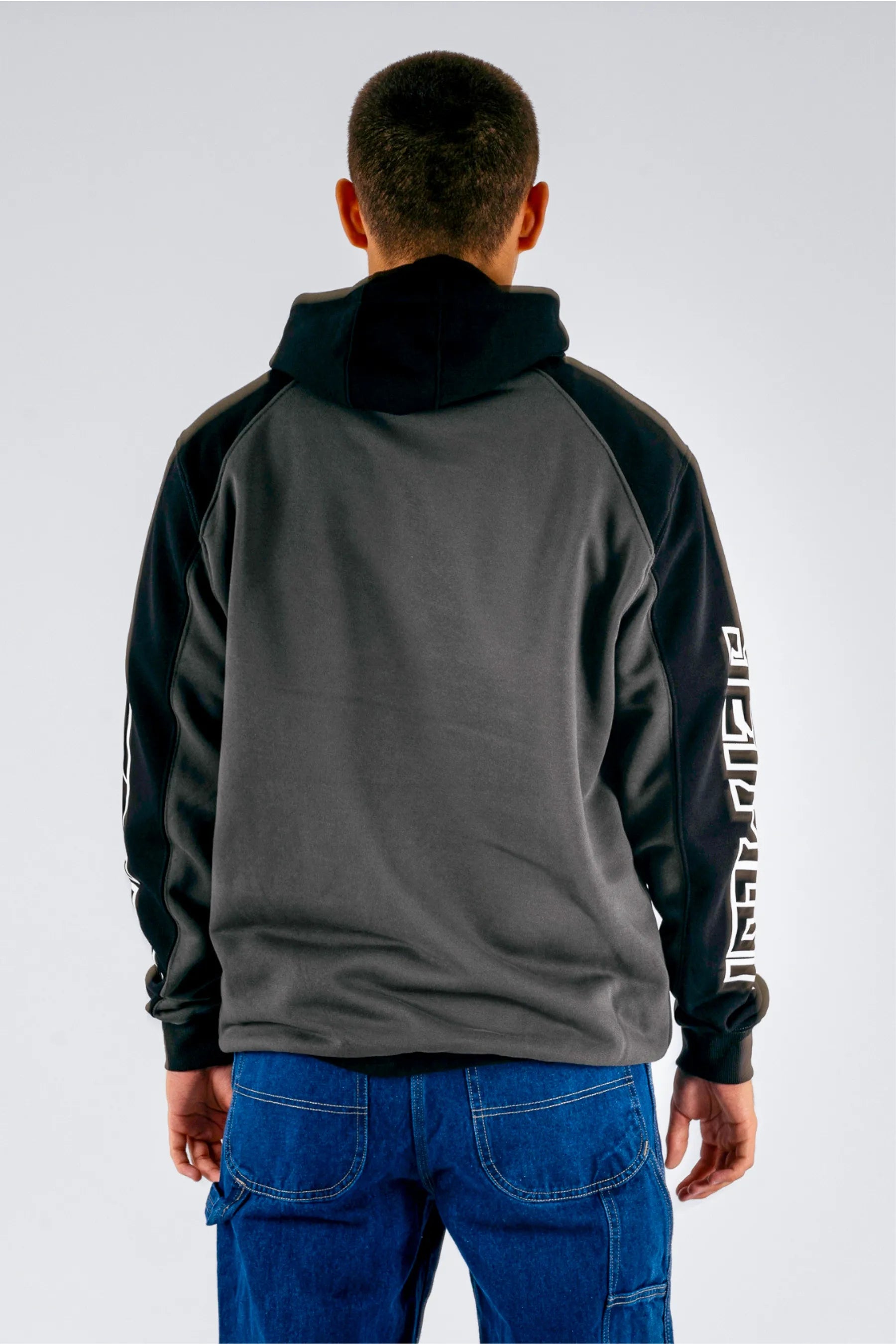 back view of a person wearing a black pullover on a white background — view 2 (3)