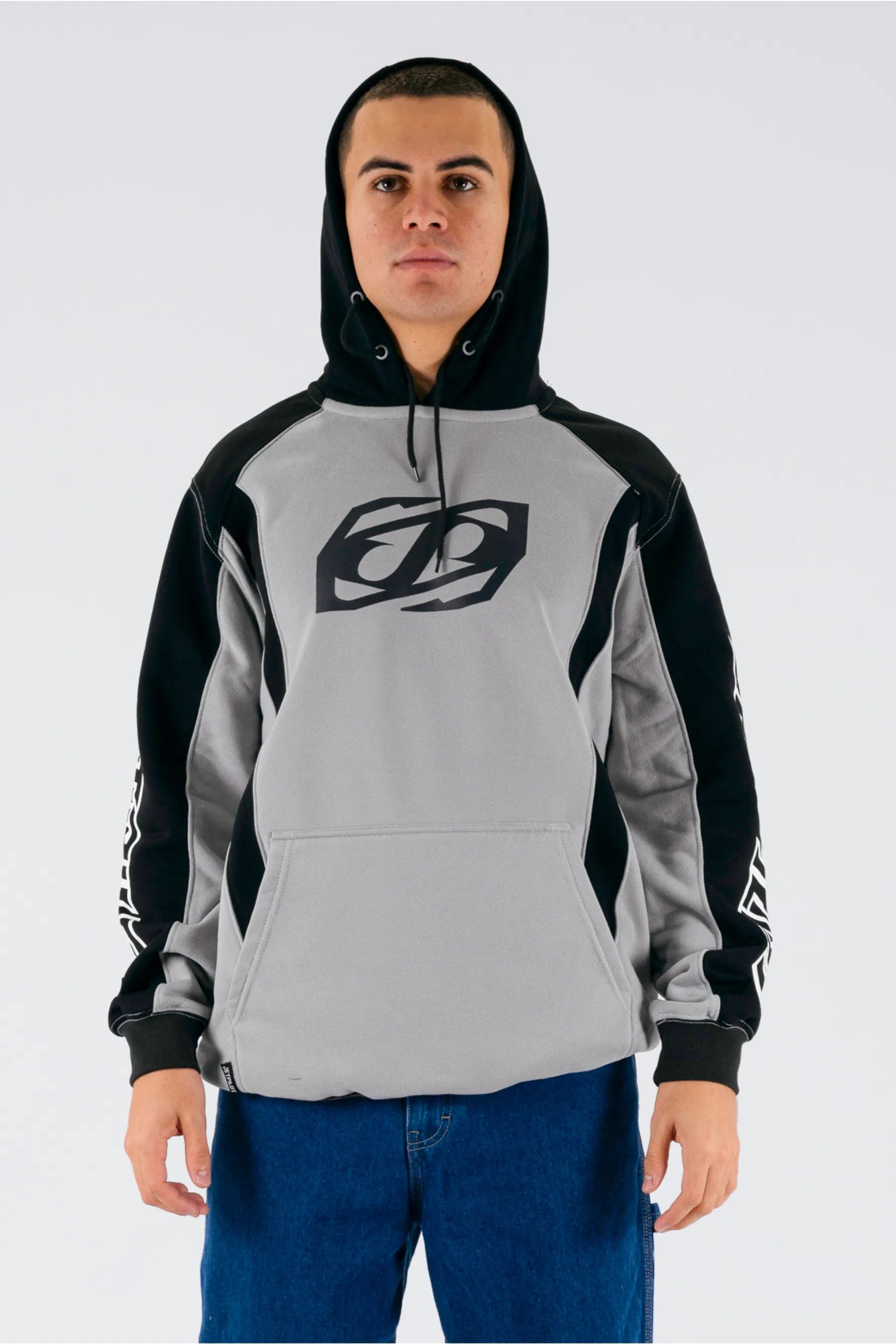 front view of a person wearing a grey/black pullover with a Jetpilot logo on a white background — view 1 (3)
