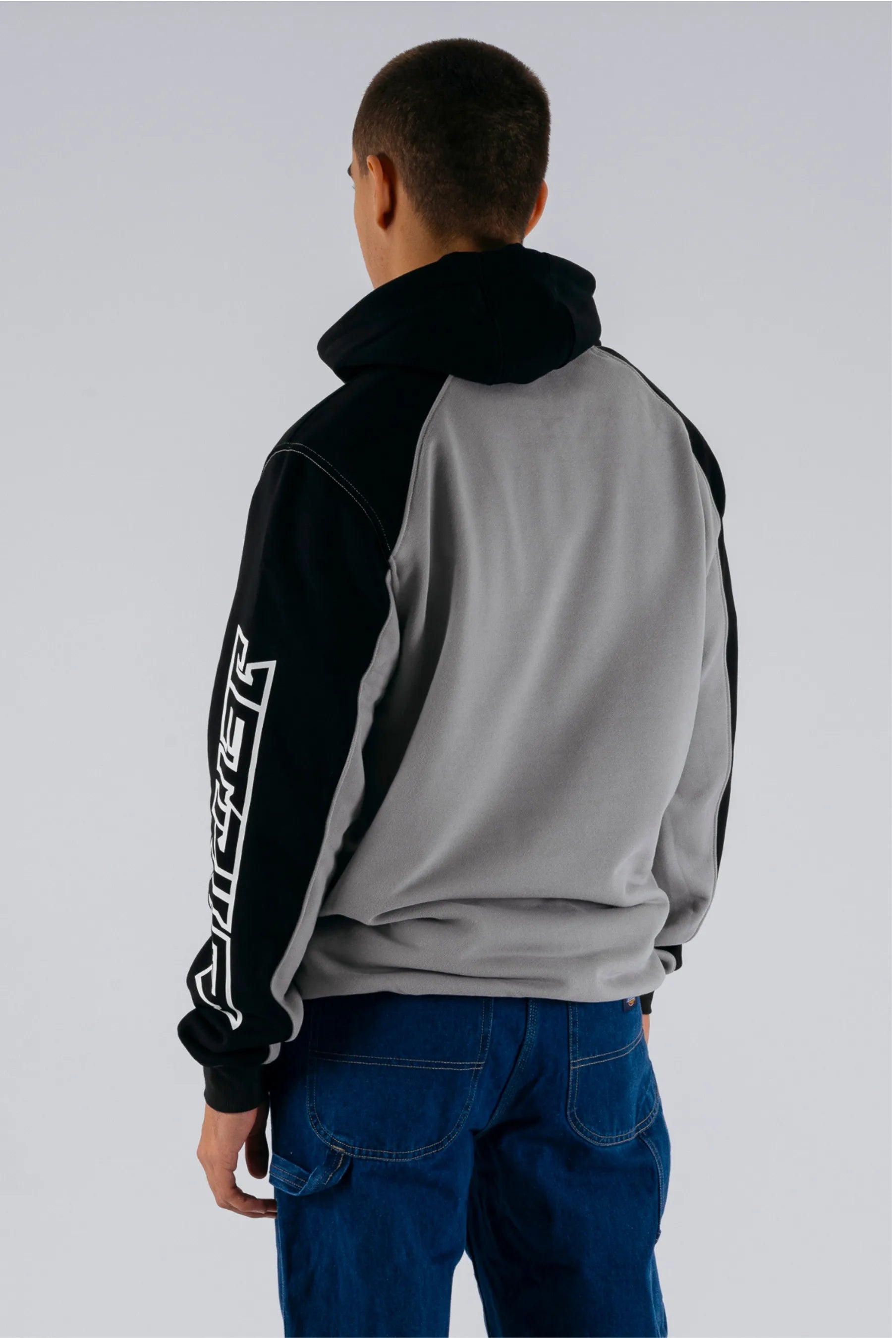 back view of a person wearing a grey/black pullover on a white background — view 2 (3)