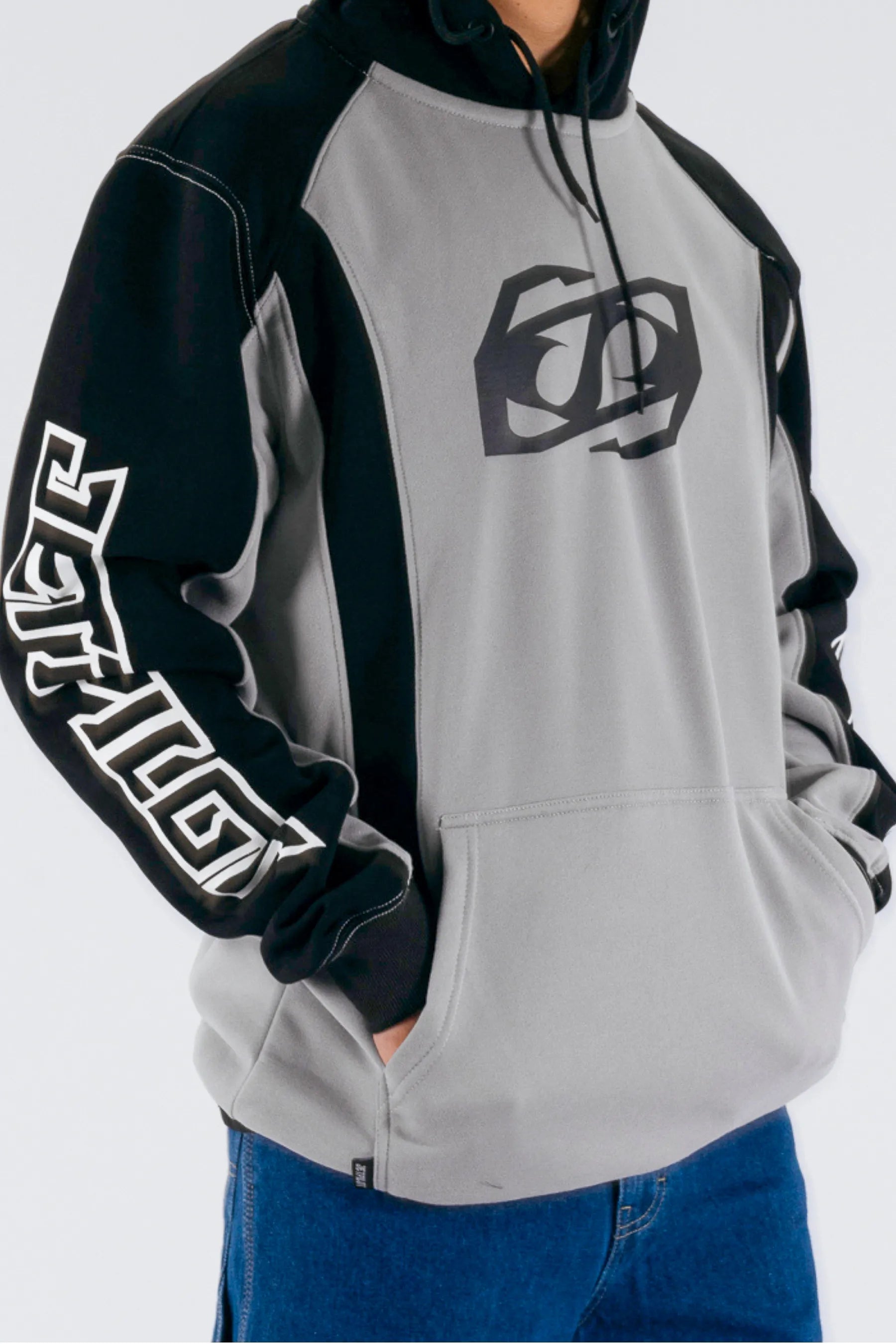 close up of a grey/black pullover with a Jetpilot logo on a white background — view 5 (3)