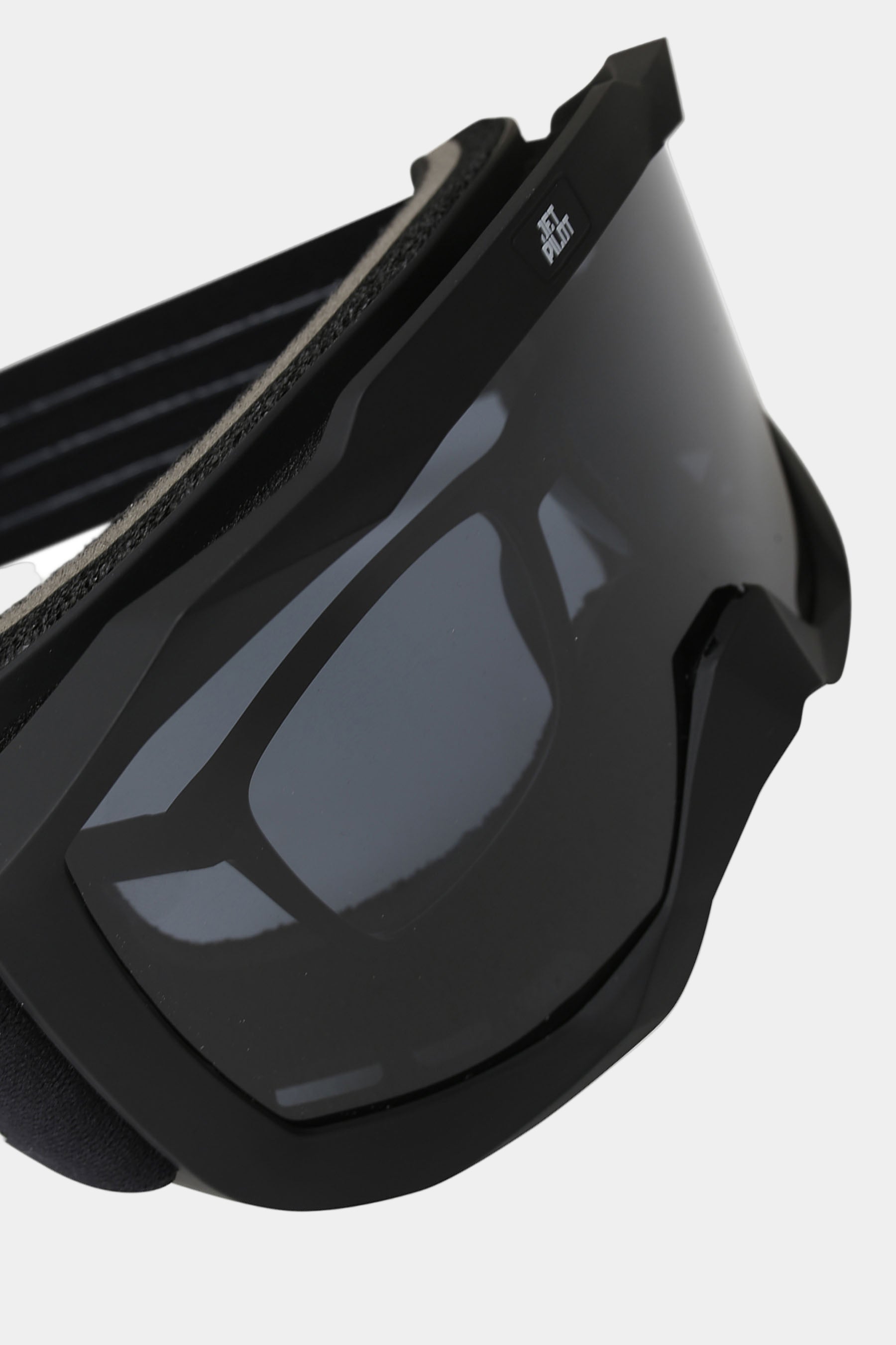 Black goggles with a reflective lens on a white background