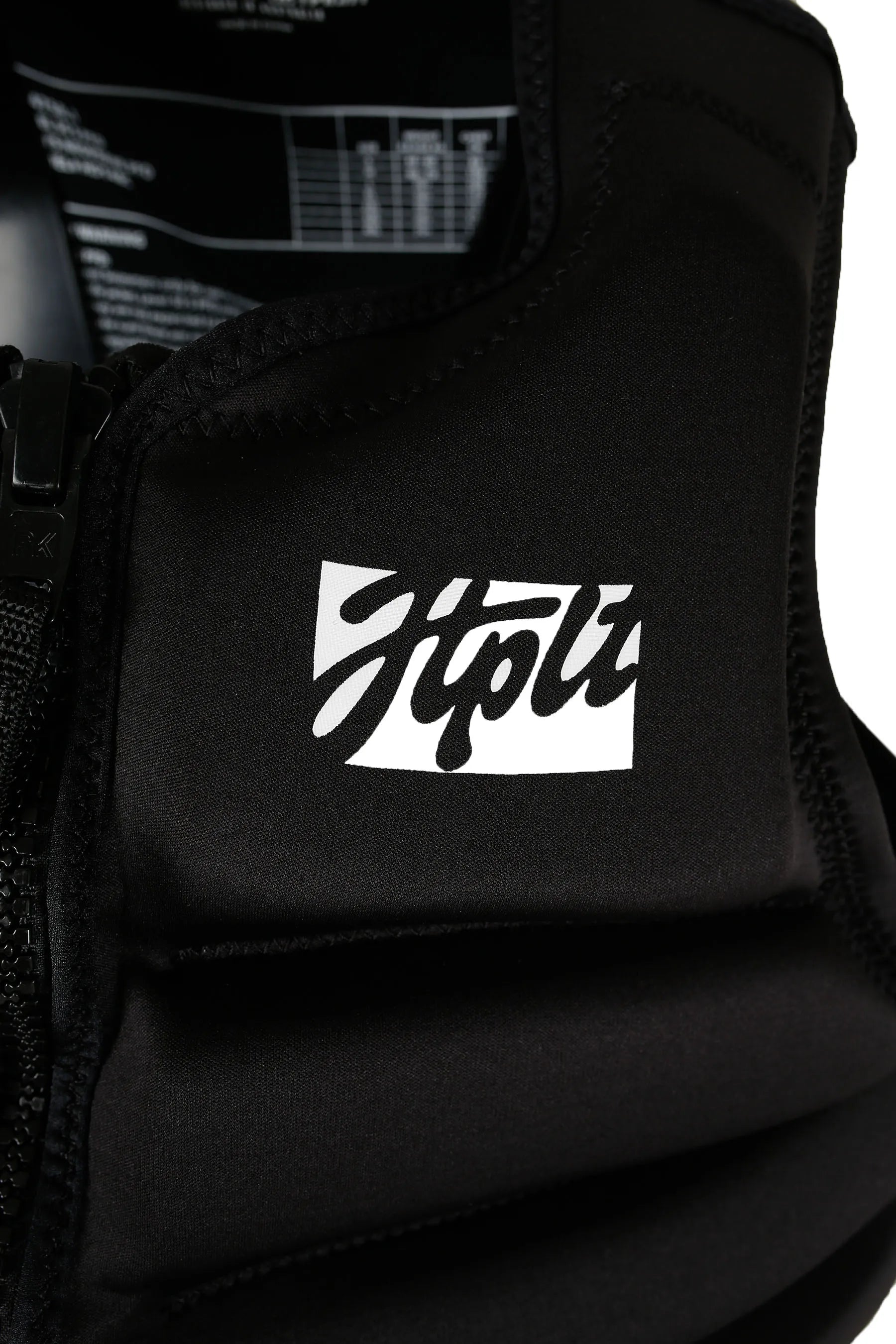 Jetpilot Phase Hyperflex Life Jacket - Black, close up with a white logo on a white background