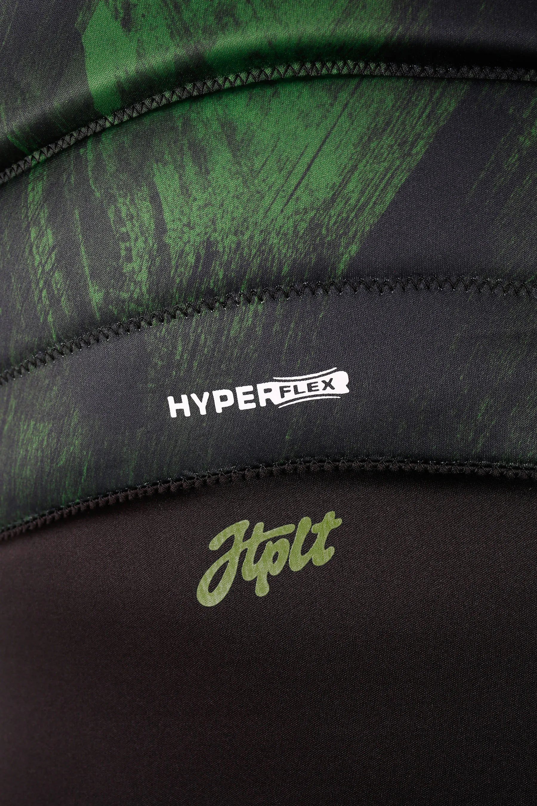 Close-up of a black and green athletic garment with 'Hyperflex' and 'Jtplt' branding.