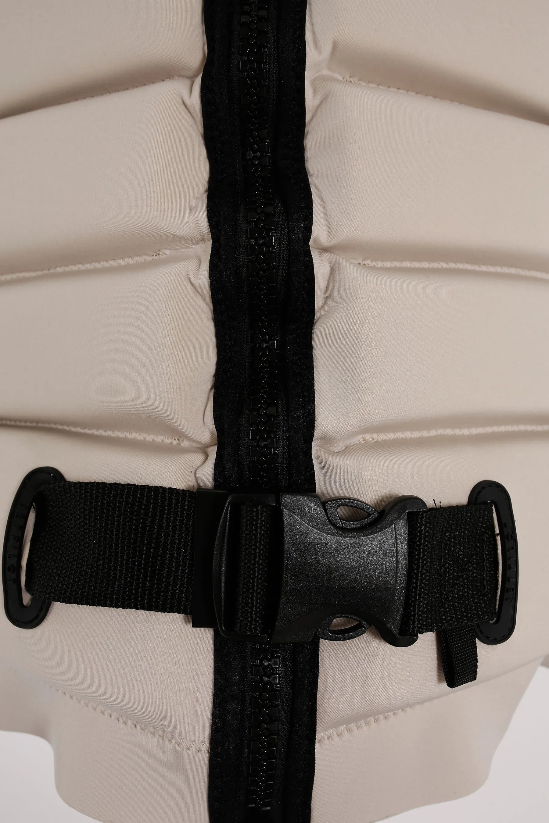 Close-up of a Jetpilot X1 Ladies Life Jacket - Zahra Kell Signature Series - Off White with black straps and zipper on a white background