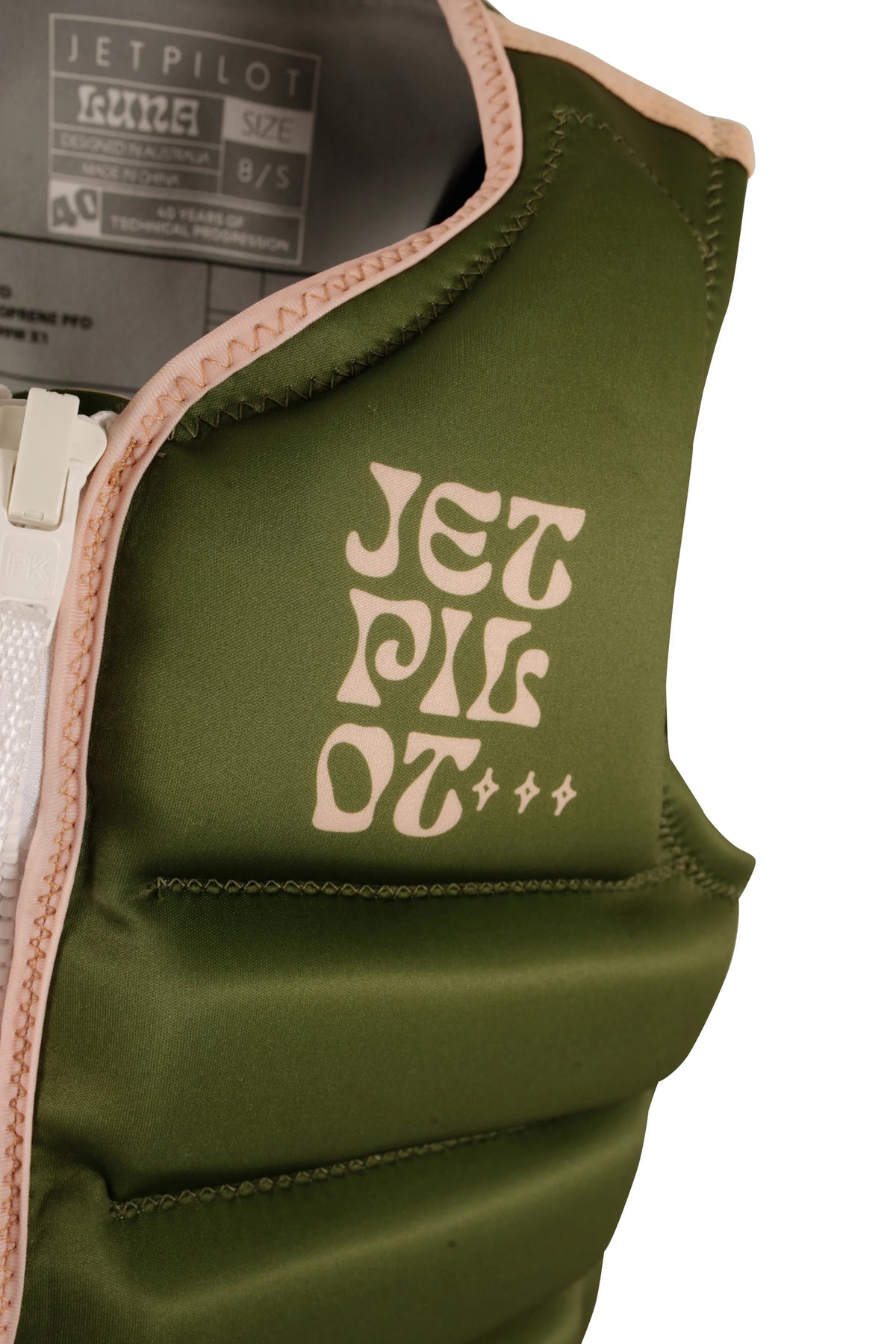 Close-up of the stacked peach Jetpilot logo on the chest and the peach collar binding of the Olive Luna