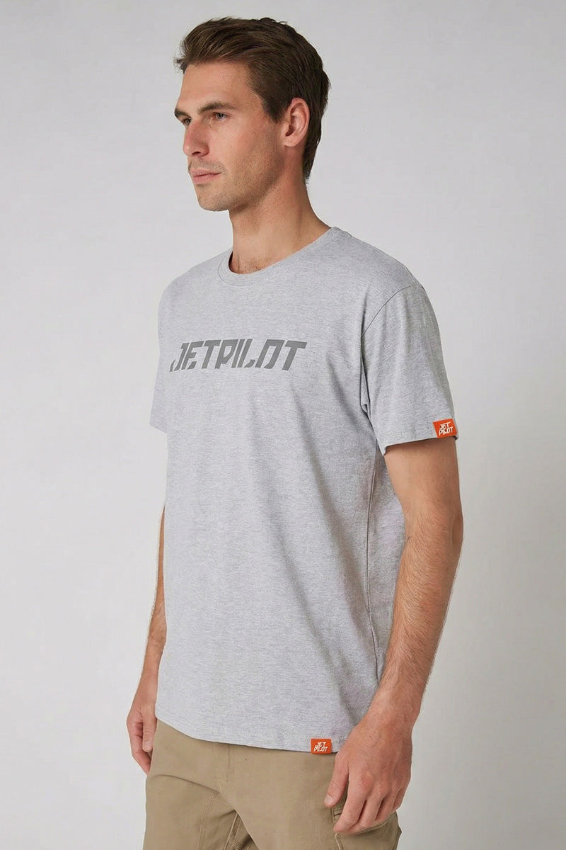 Man wearing a gray t-shirt with branding on a plain background — view 2 (3)