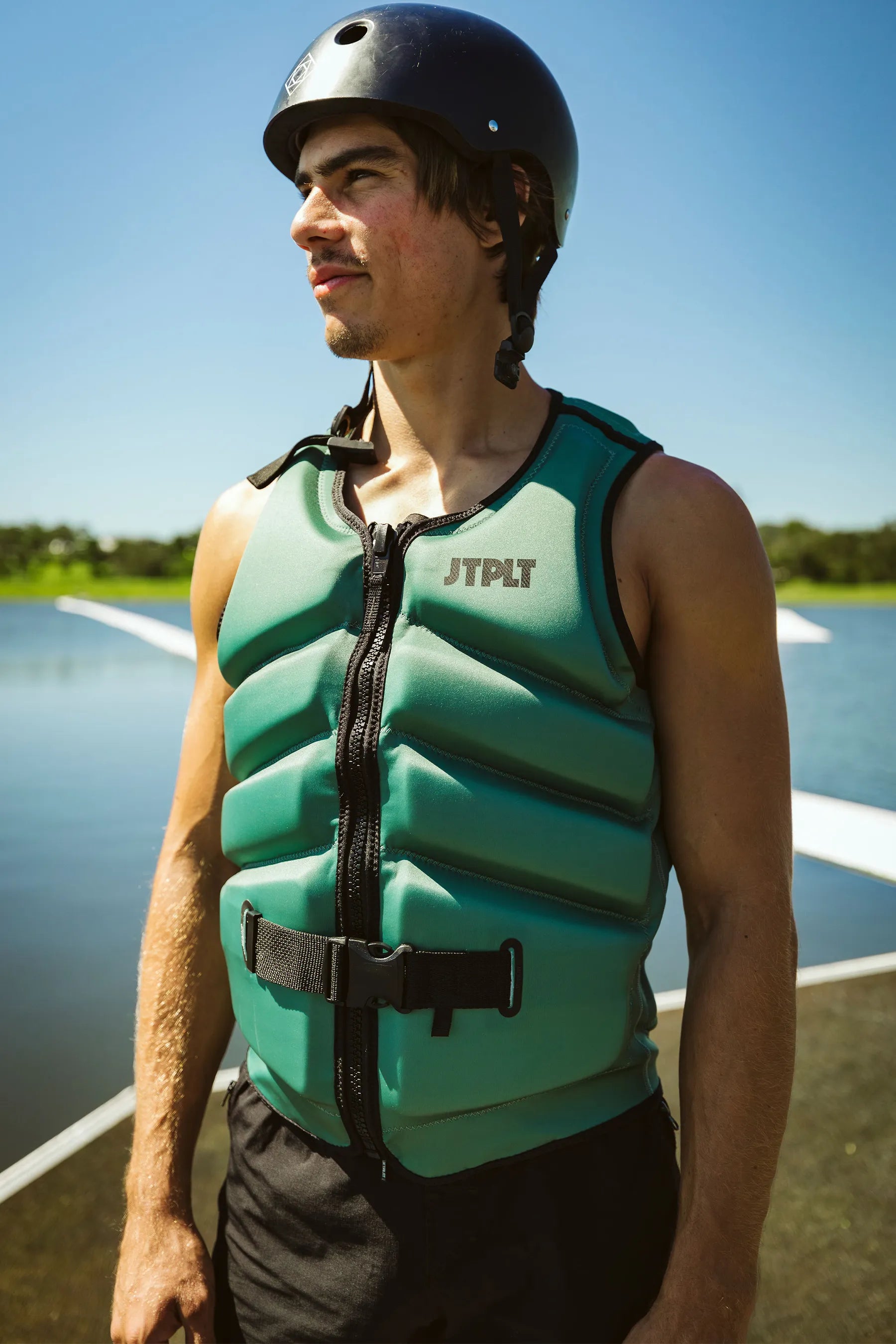 Jetpilot Freeride Life Jacket - Sage in the background of wakepark