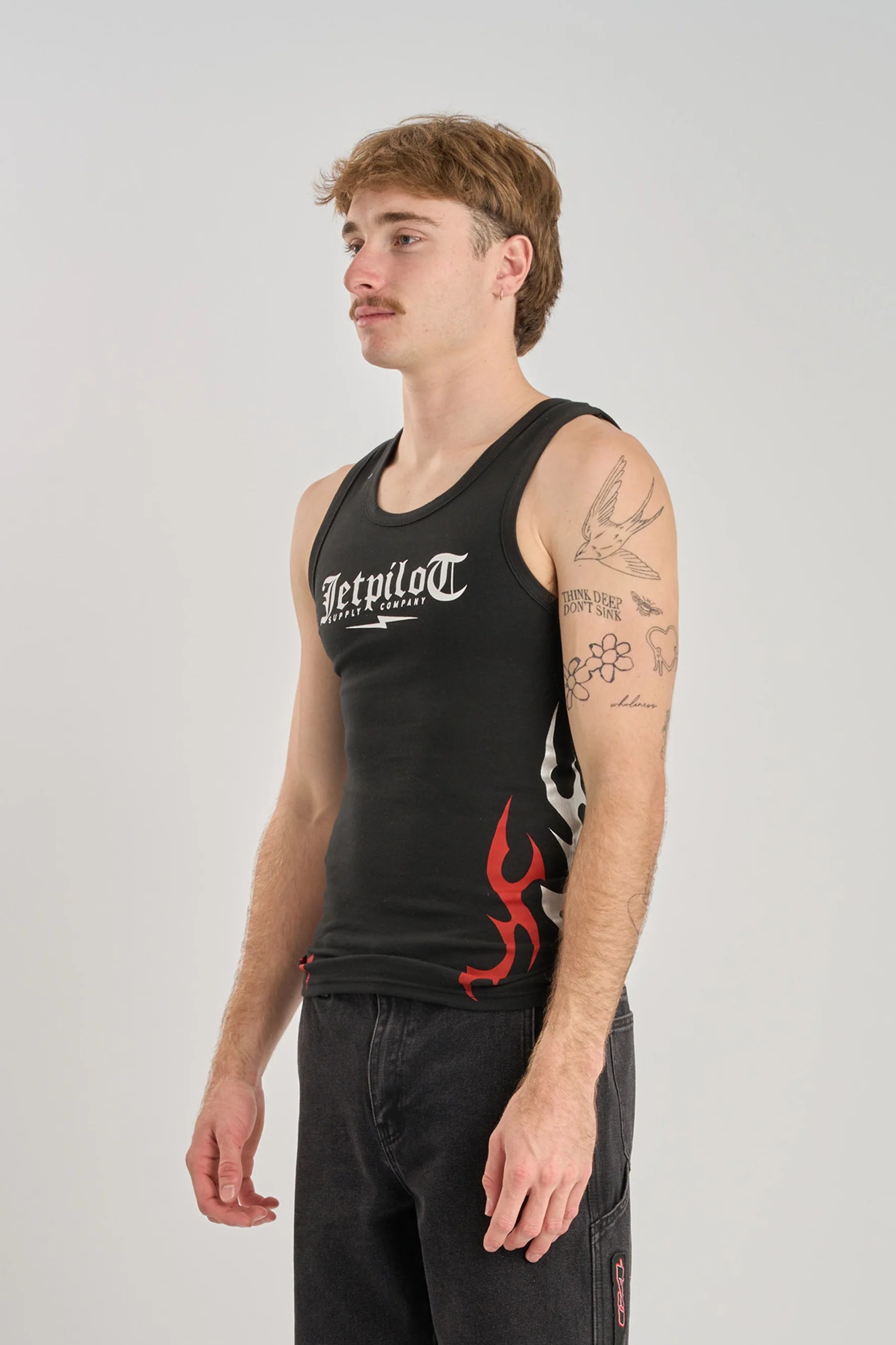 Jetpilot Tribal Singlet - Black with red and white graphics on a plain background