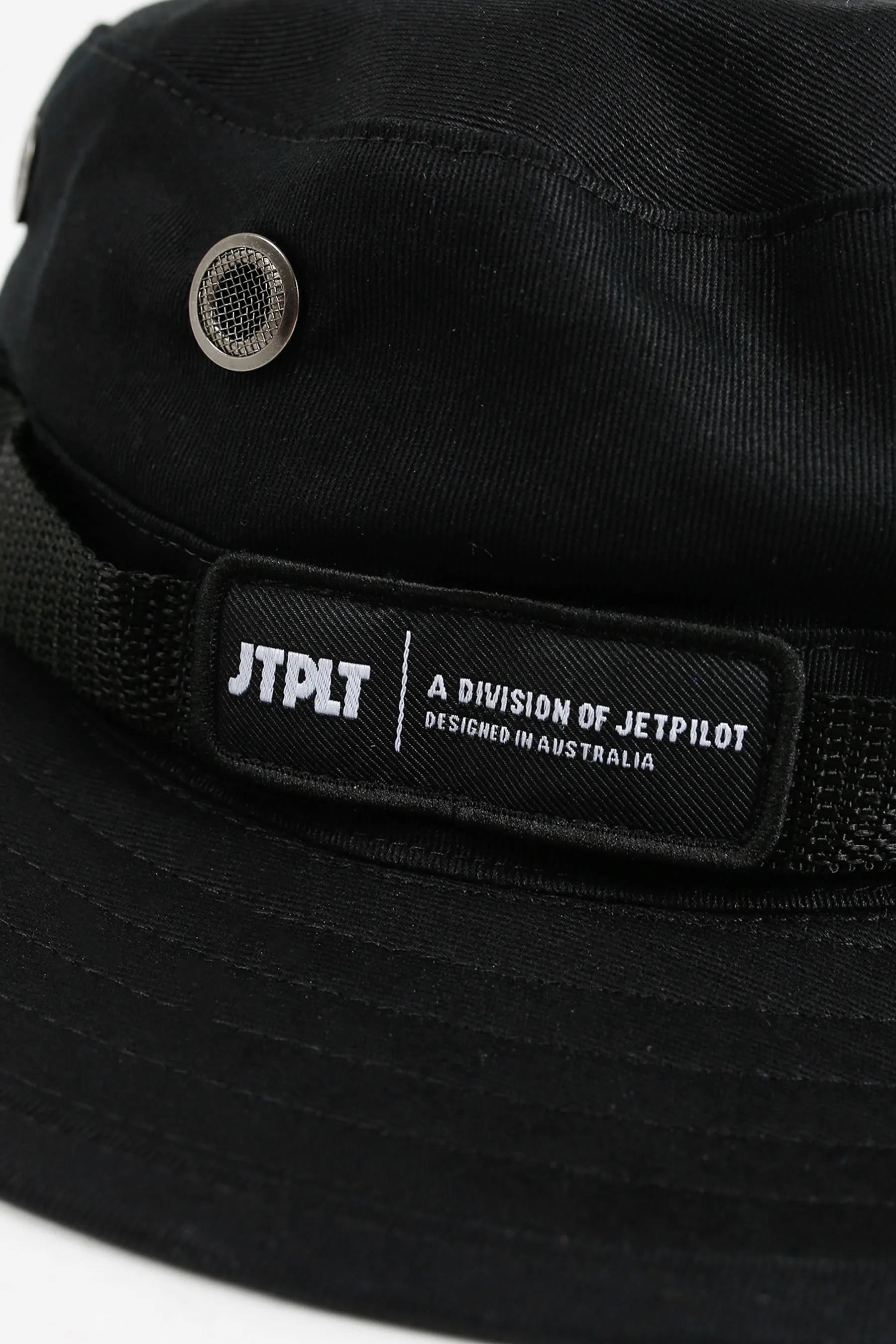 Black cap with a visible brand label on a white background