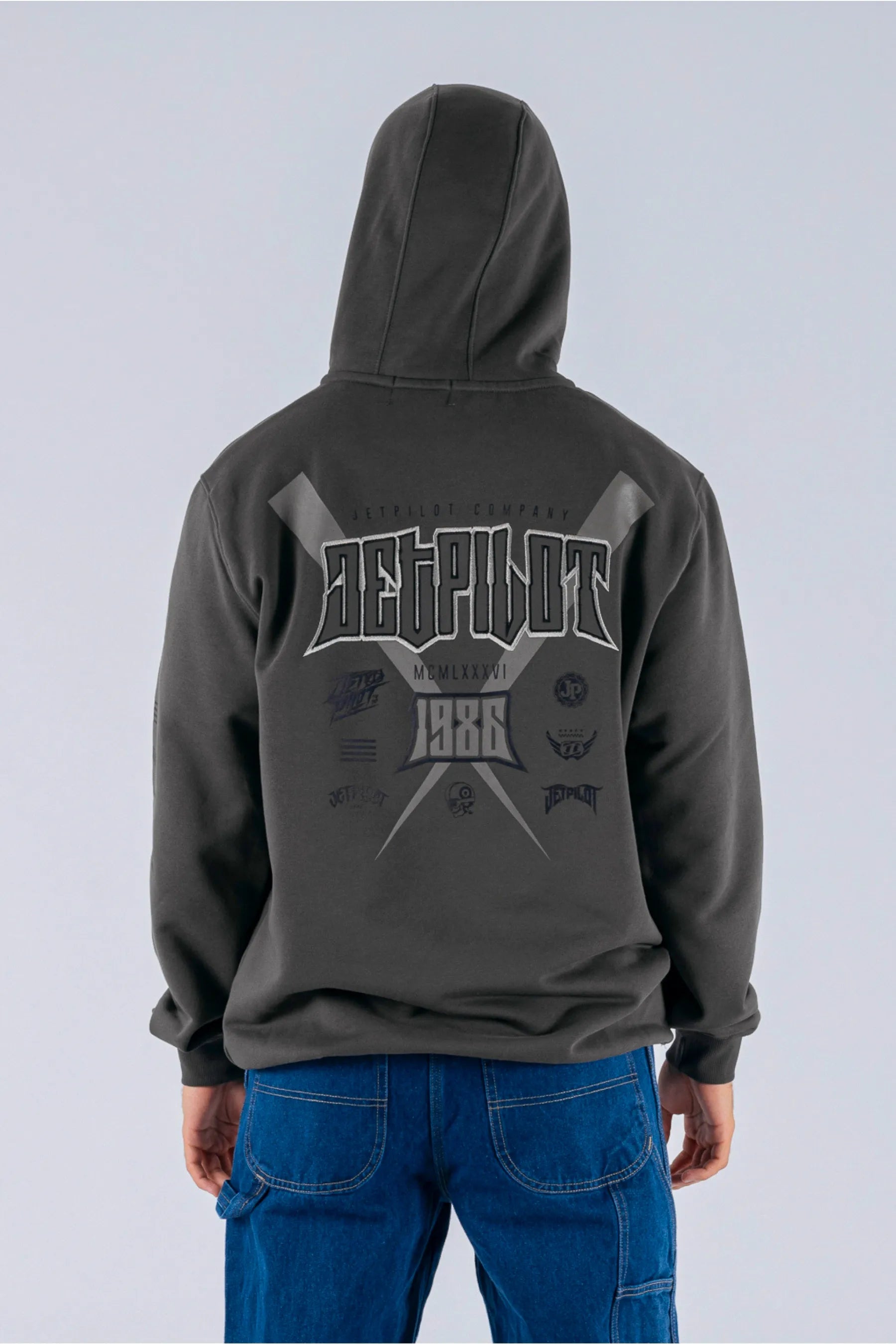 back view of a person wearing charcoal pullover with a Jetpilot logo on a white background — view 2 (3)