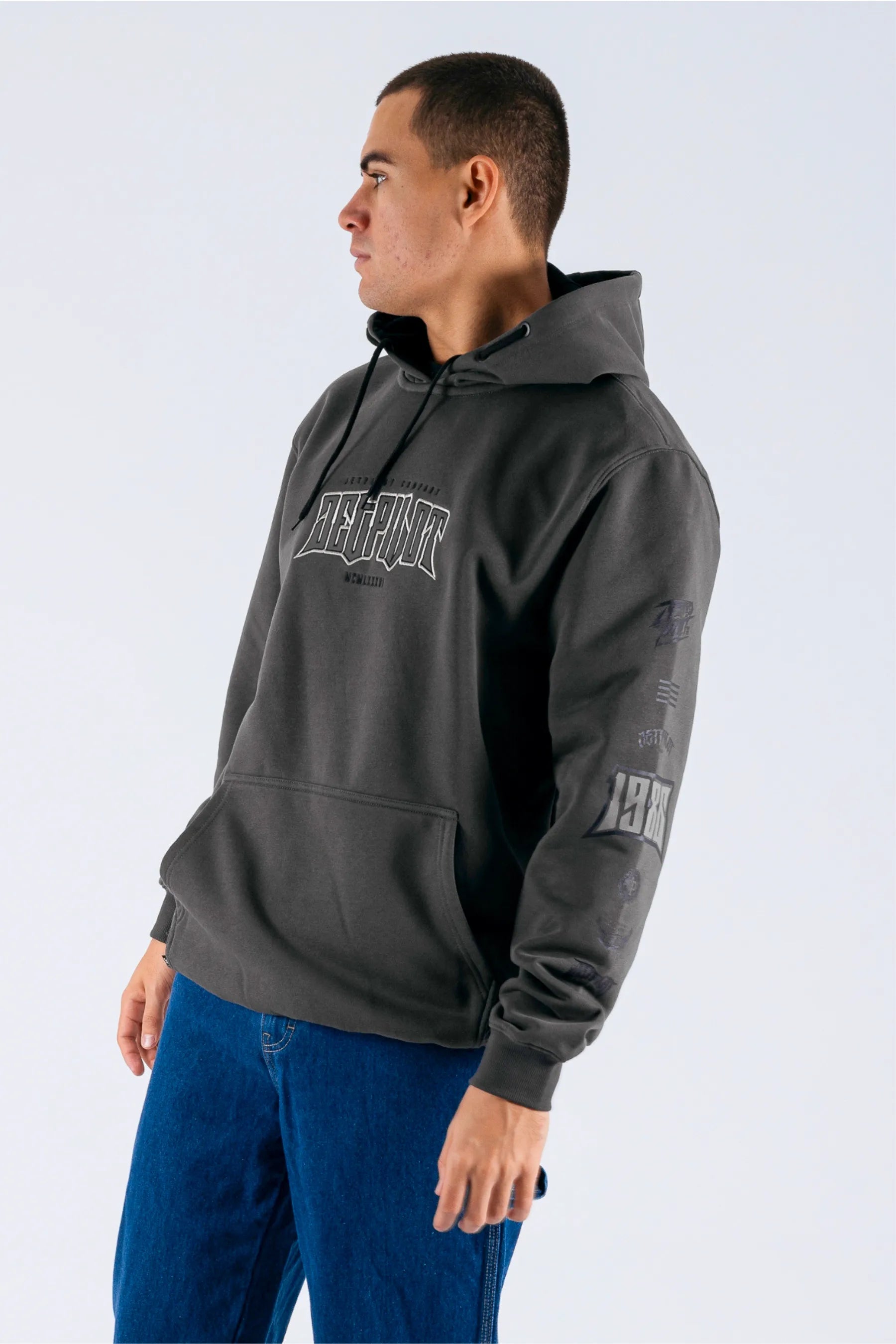 a person wearing a charcoal pullover with a Jetpilot logo — view 4 (4)
