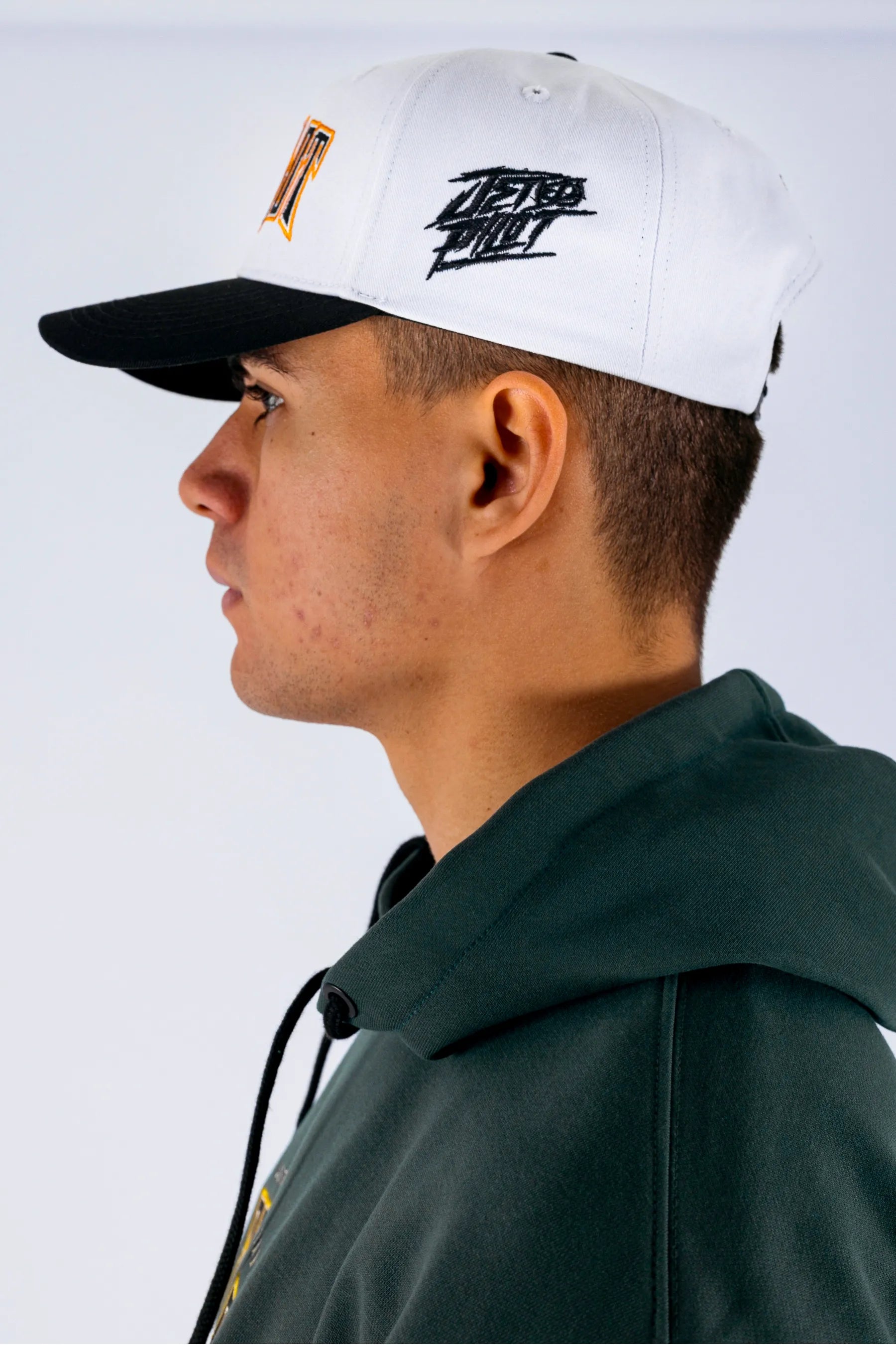 Side view of a person wearing a white snapback with a Jetpilot logo on a white background — view 5 (3)
