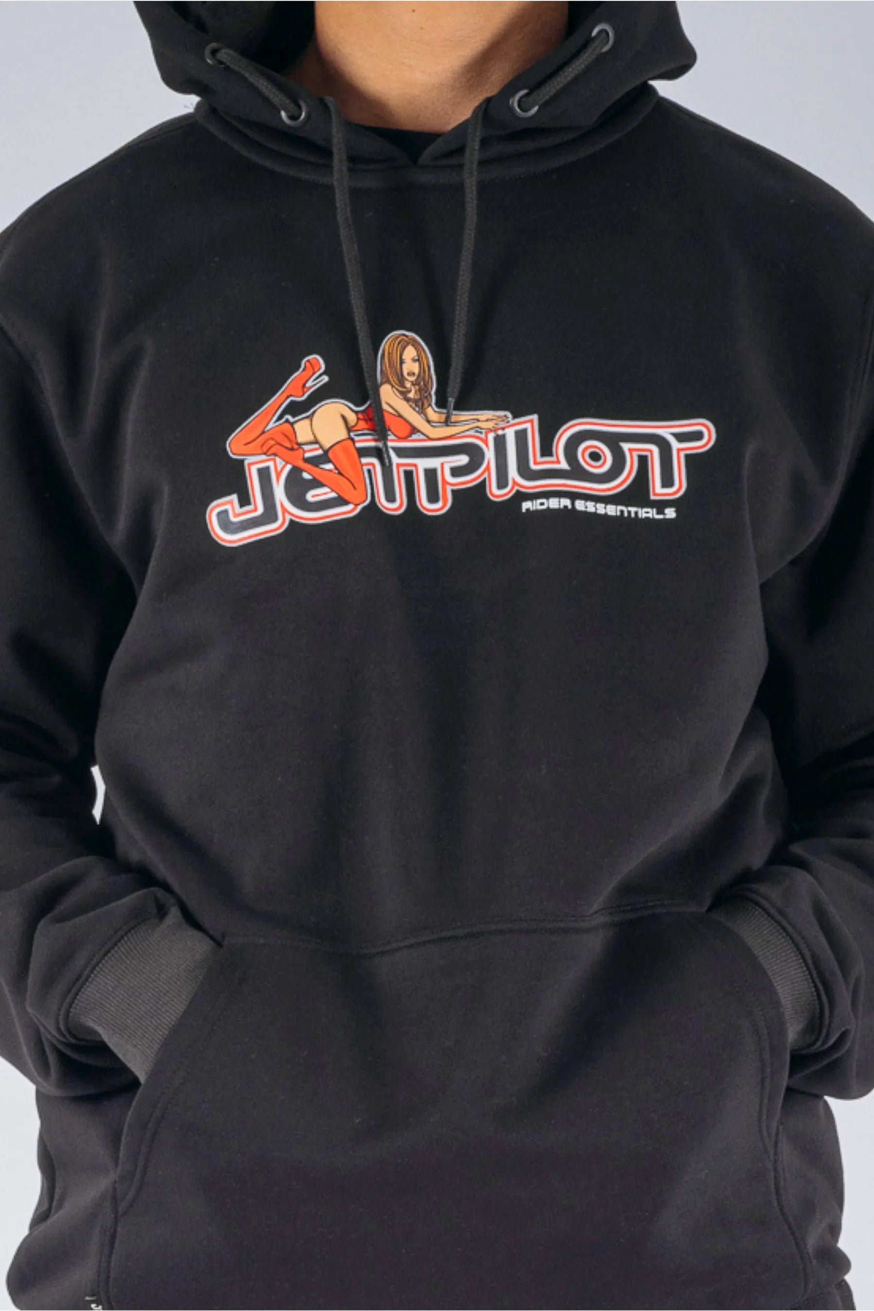 close up of a person wearing a black  pullover with a Jetpilot logo on a white background — view 3 (3)