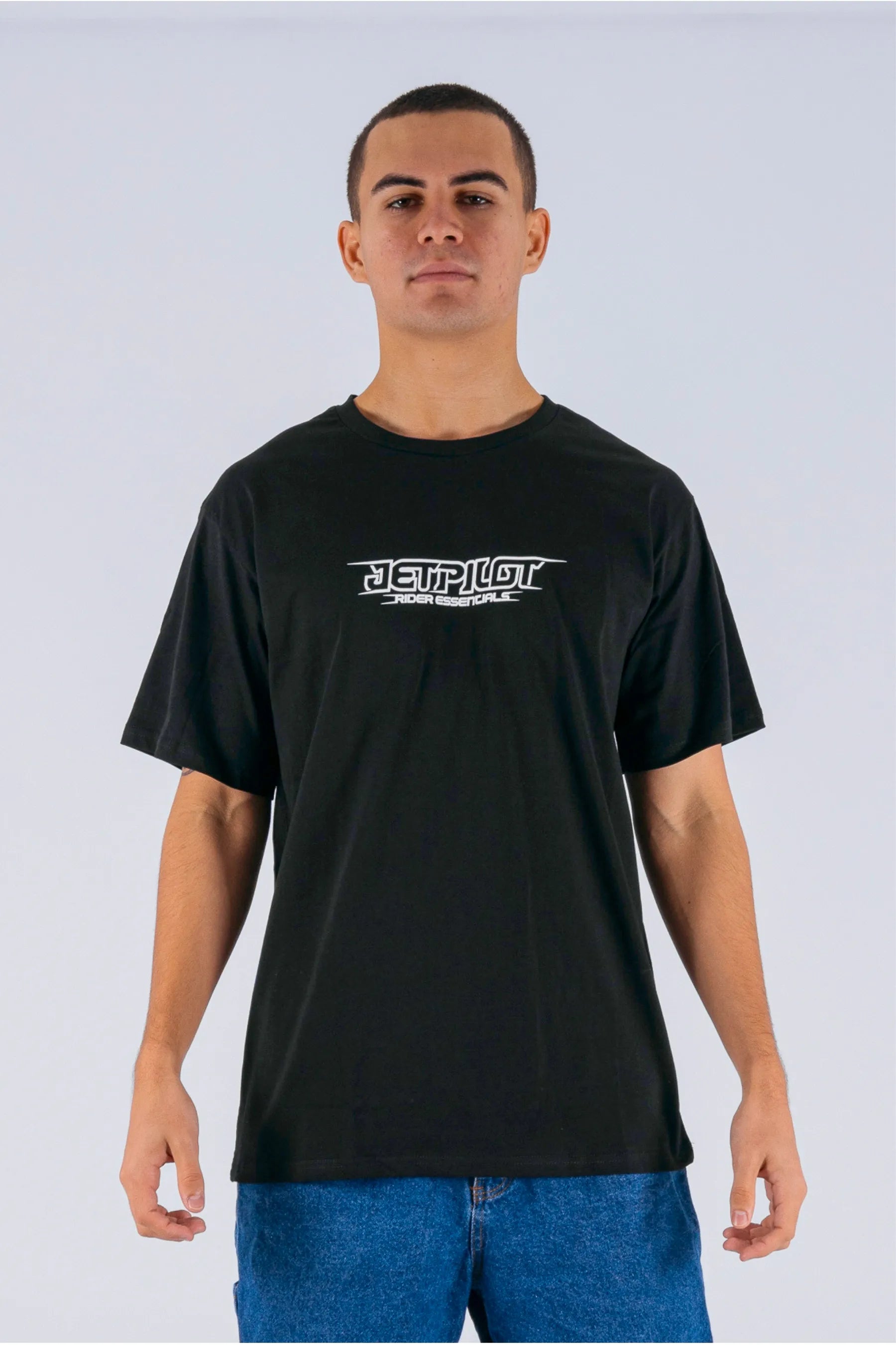 front view of a person wearing a black tee with a Jetpilot logo on a white background — view 1 (3)