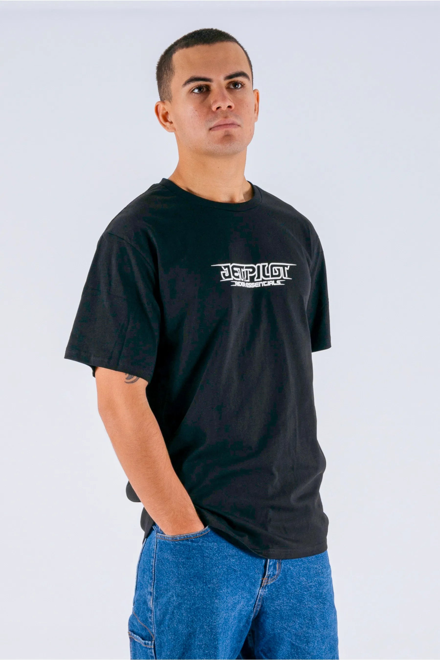 a person wearing a black tee with a Jetpilot logo — view 5 (3)