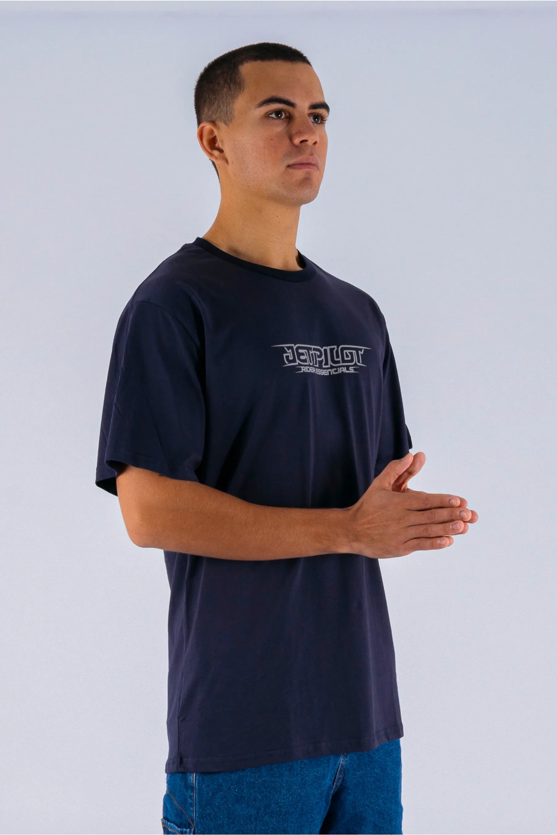 a person wearing a dark blue tee with a Jetpilot logo — view 3 (3)