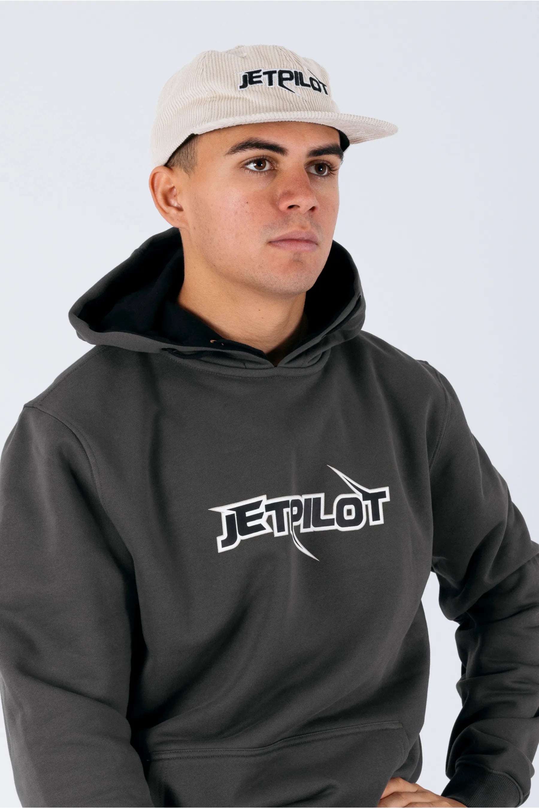 Right side view of a person wearing a cement corduroy panel with a Jetpilot logo on a white background — view 2 (3)