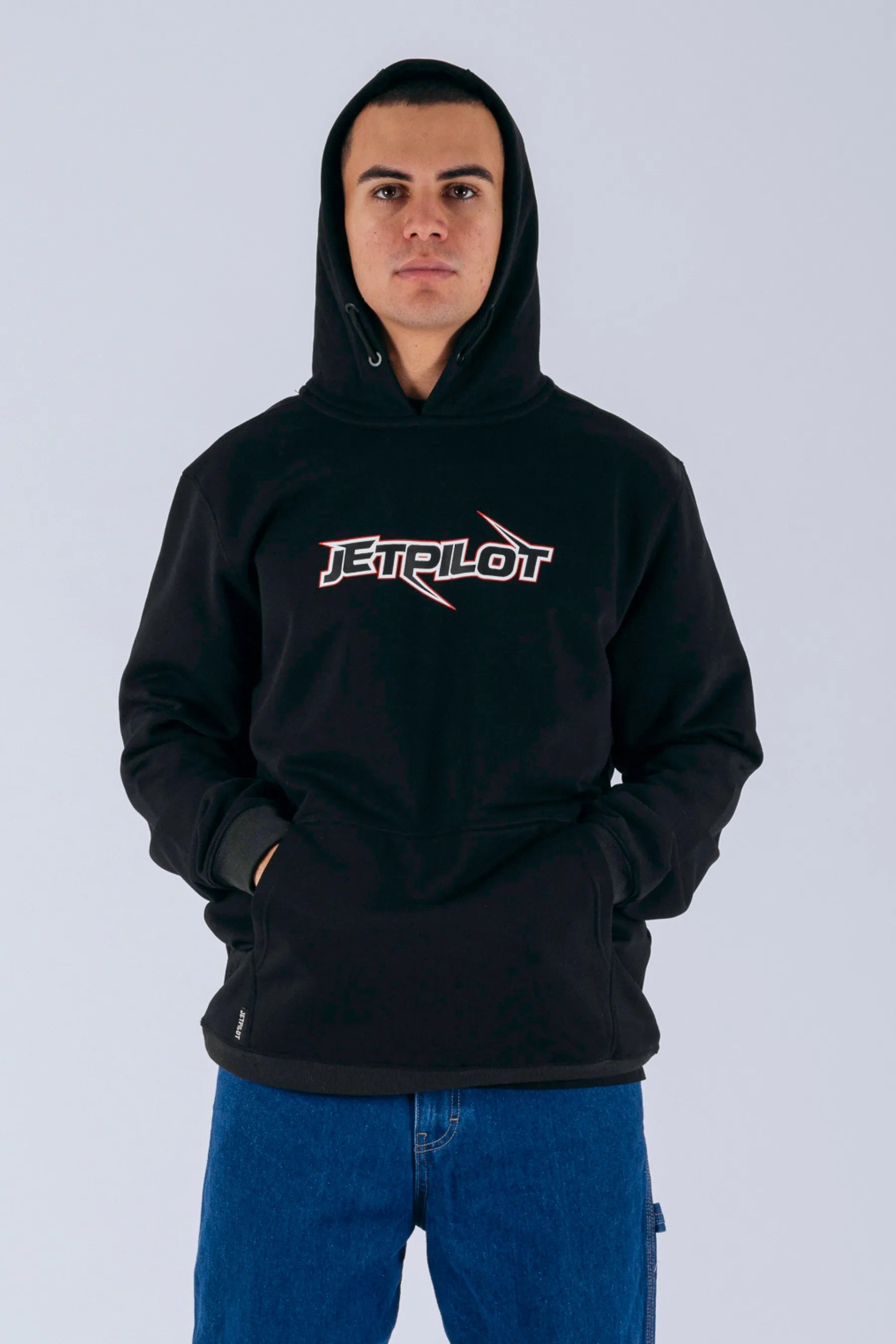 front view of a person wearing a black pullover with a Jetpilot logo on a white background — view 1 (6)